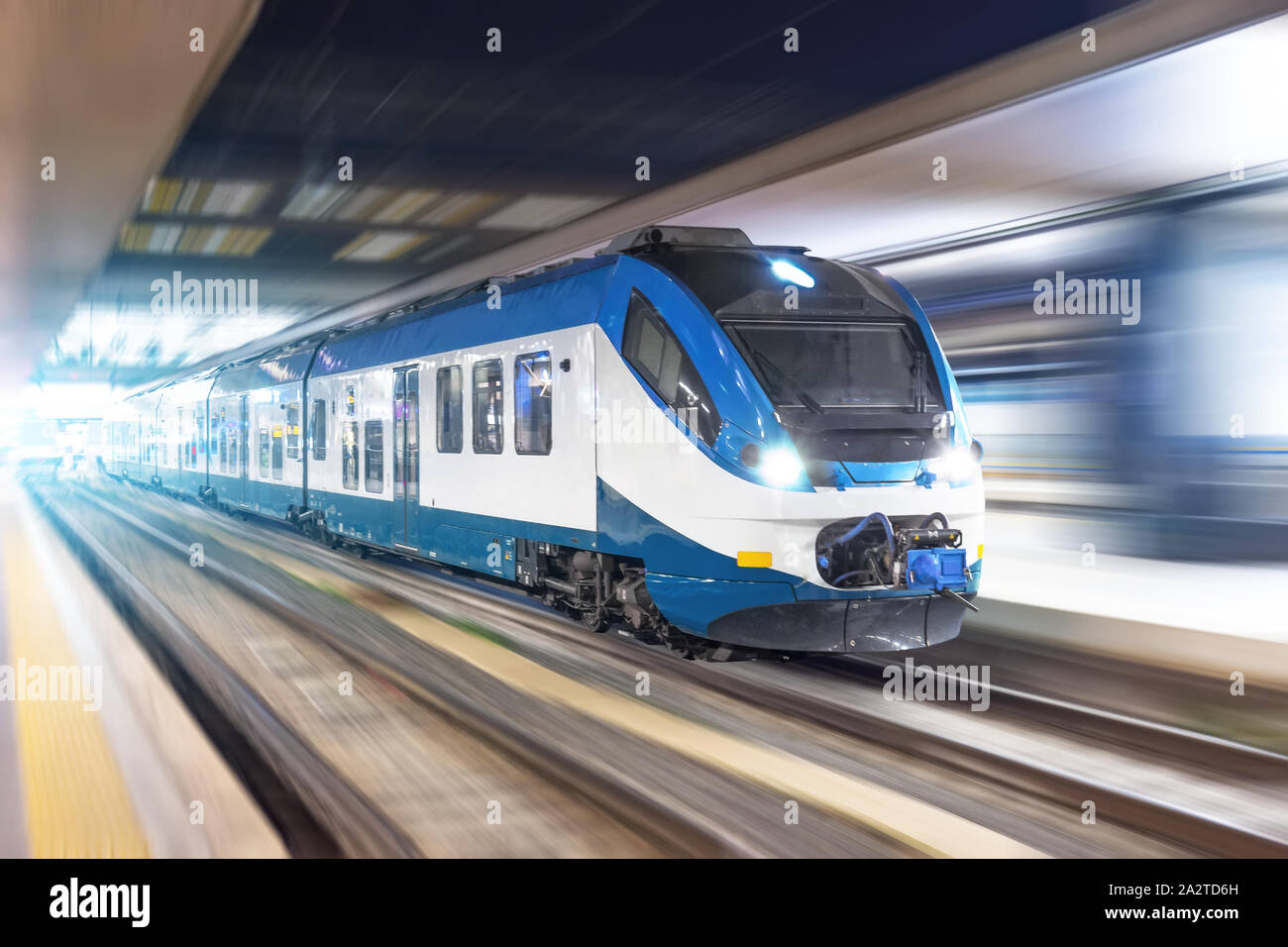 Railroad travel passenger train with motion blur effect night, industrial concept, tourism Stock Photo