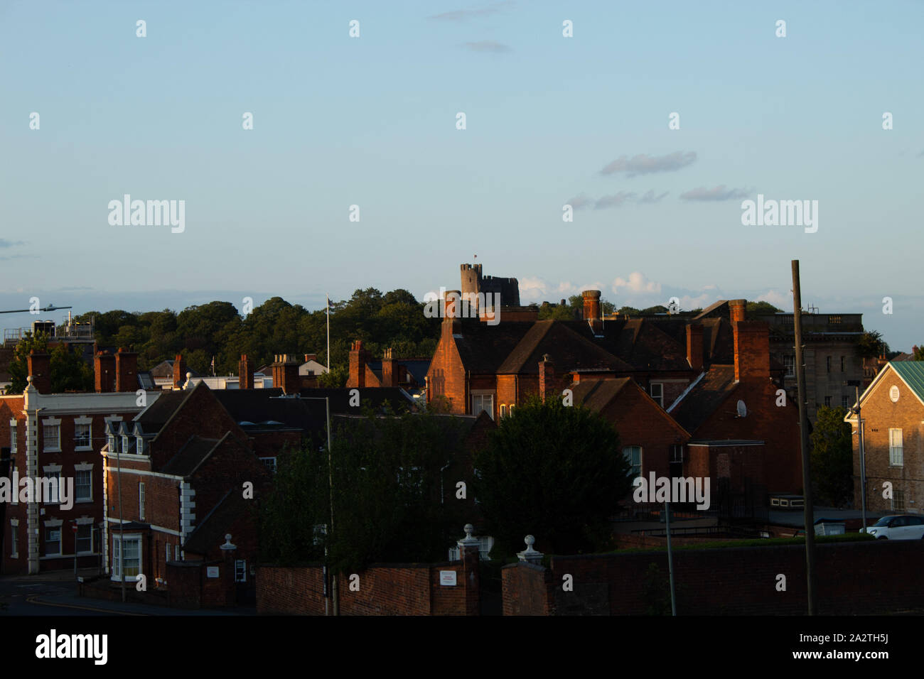 Dudley Castle on top of hill and Dudley town, brick houses. Stock Photo