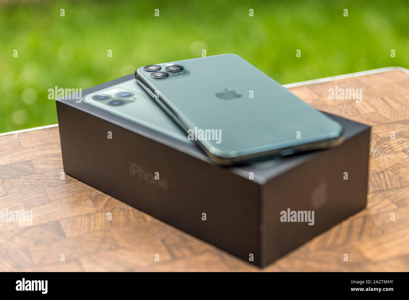 iPhone 11 Pro MAX Midnight Green laying on its box. Portland, Oregon / USA - October 2019. Stock Photo