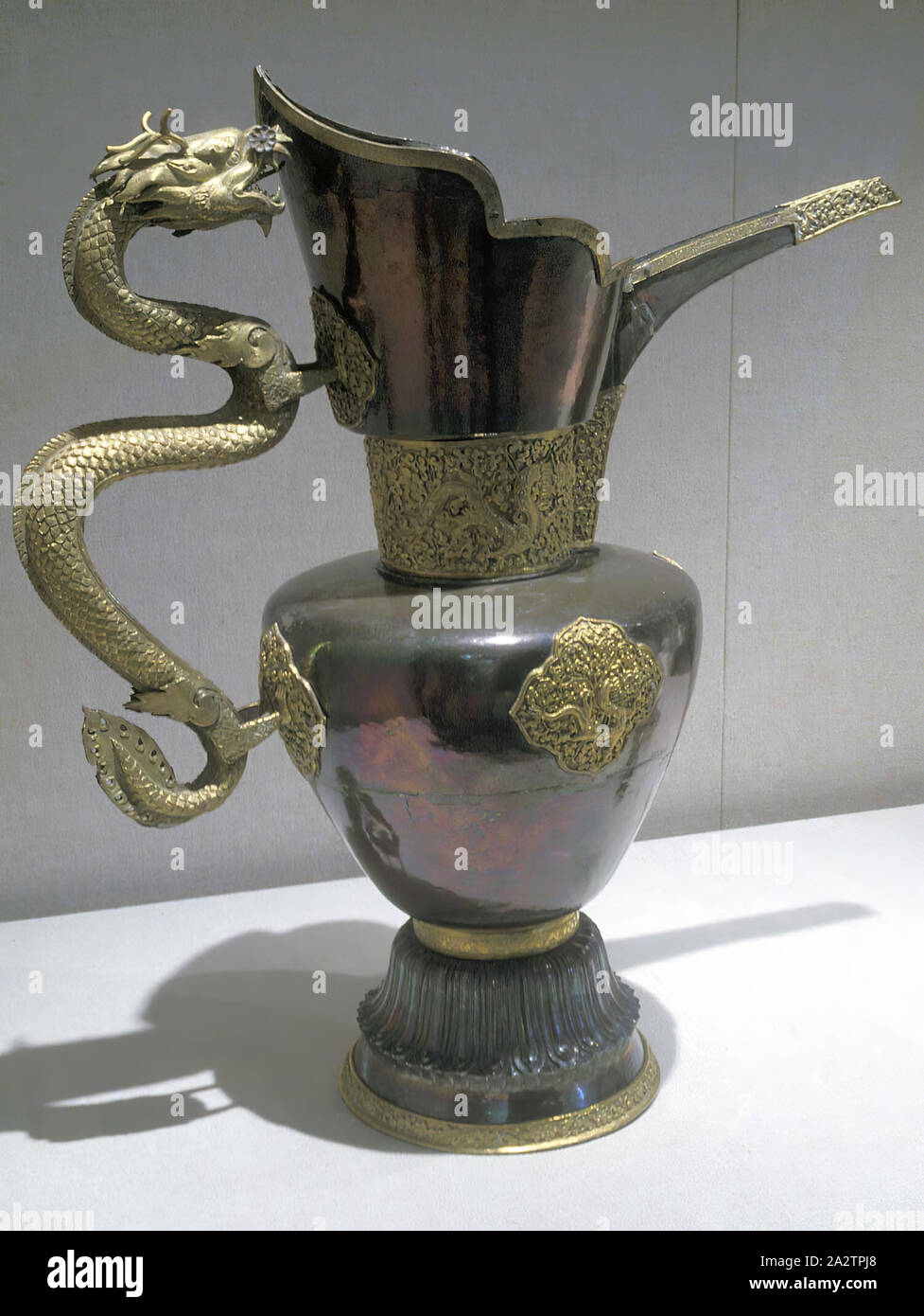 Monk's cap ewer (sengmaohu) with dragon motifs, Qing dynasty, Qing dynasty, 1700s, silver, gilt copper, H: 20-7/8 in., Asian Art Stock Photo