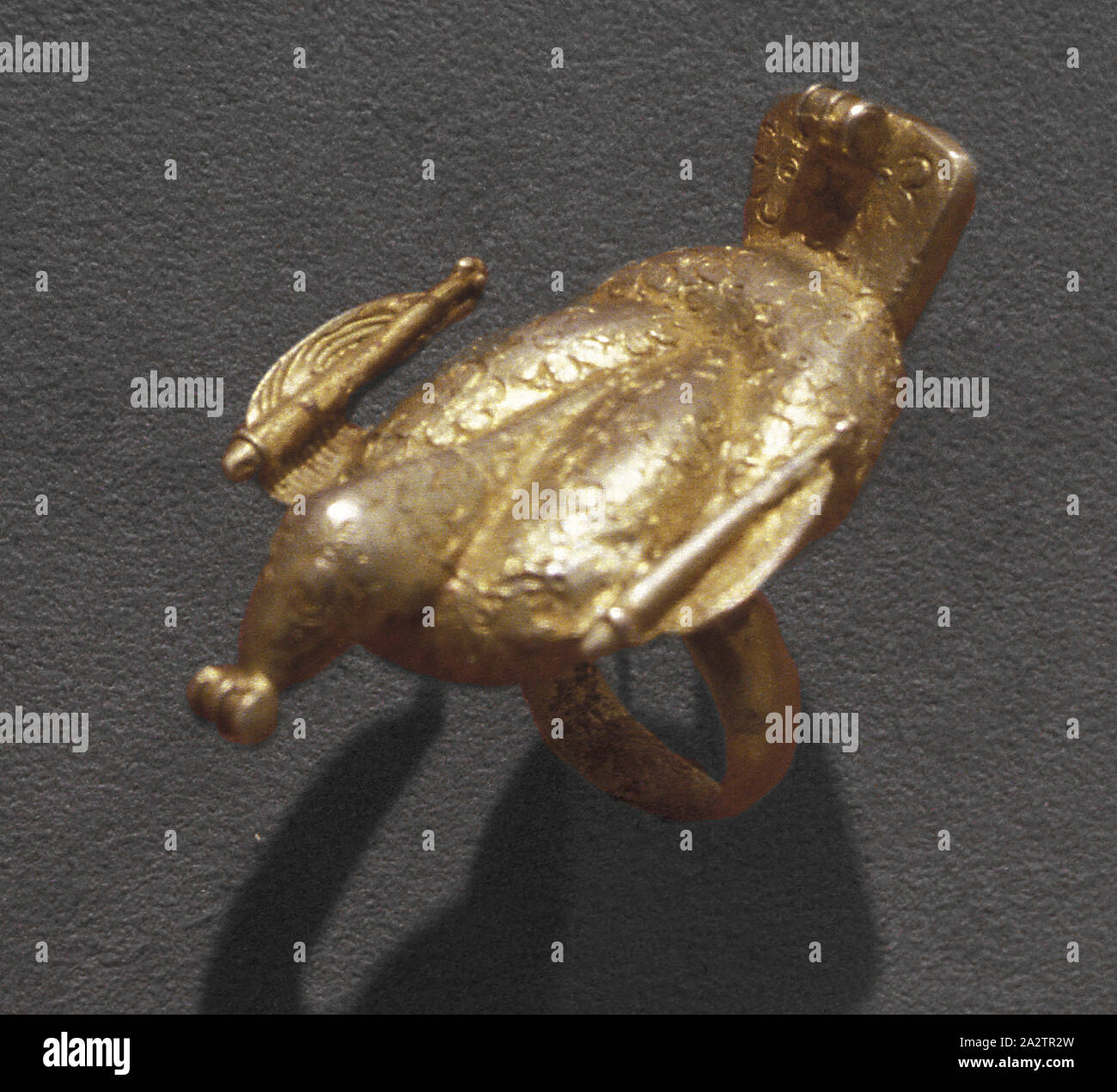 ring with bird, Akan people, gilded alloy, African Art Stock Photo