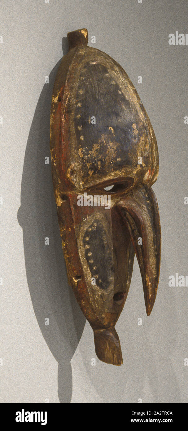 face mask, 1930-1950, wood, pigment, 21-3/8 x 8 x 5-3/4 in., South Pacific Art Stock Photo