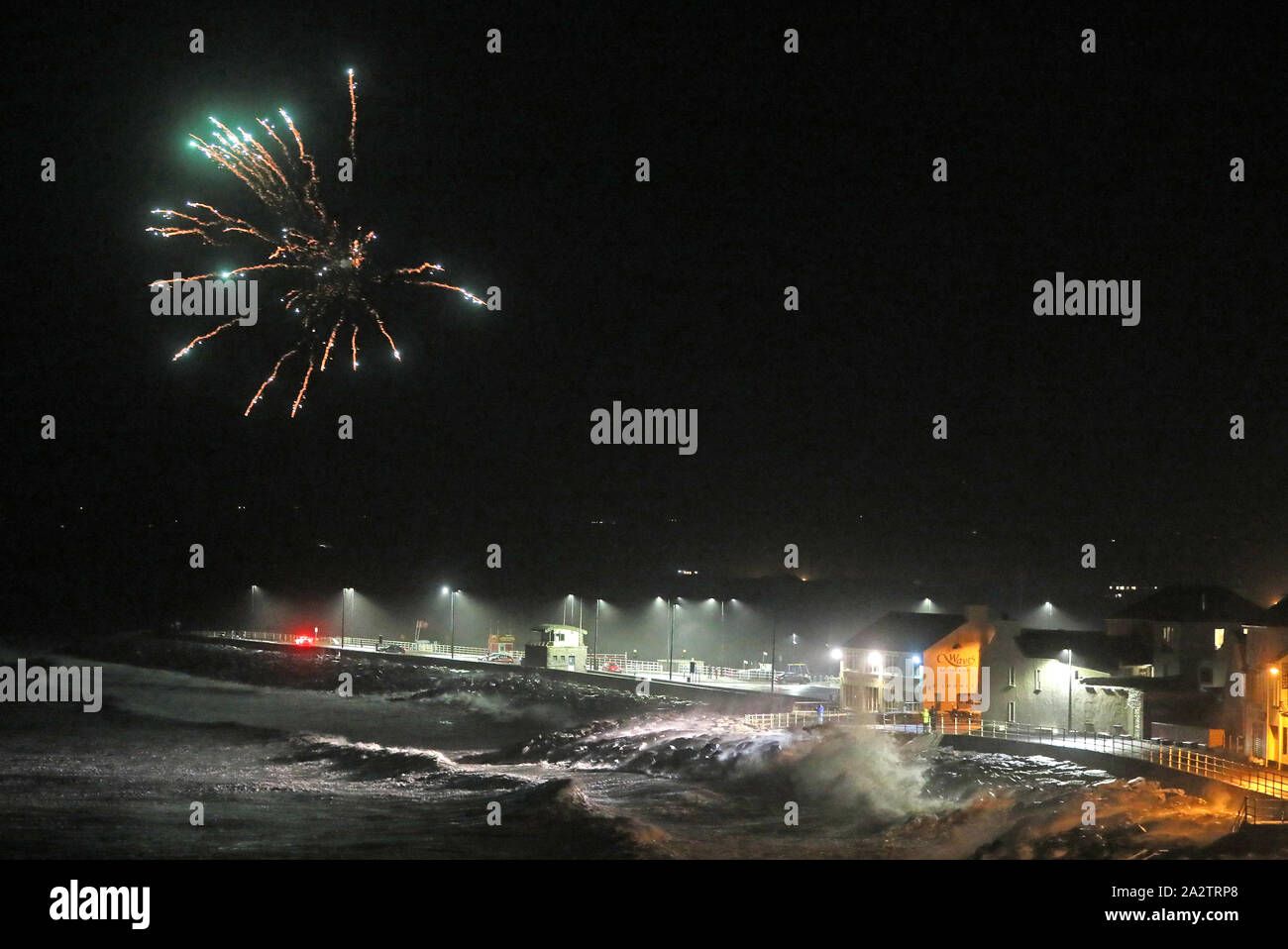 Fireworks in the sky over the sea in Lahinch, County Clare, on the West Coast of Ireland as storm Lorenzo makes landfall, with a status orange wind warning and a yellow rain warning having been issued. Stock Photo