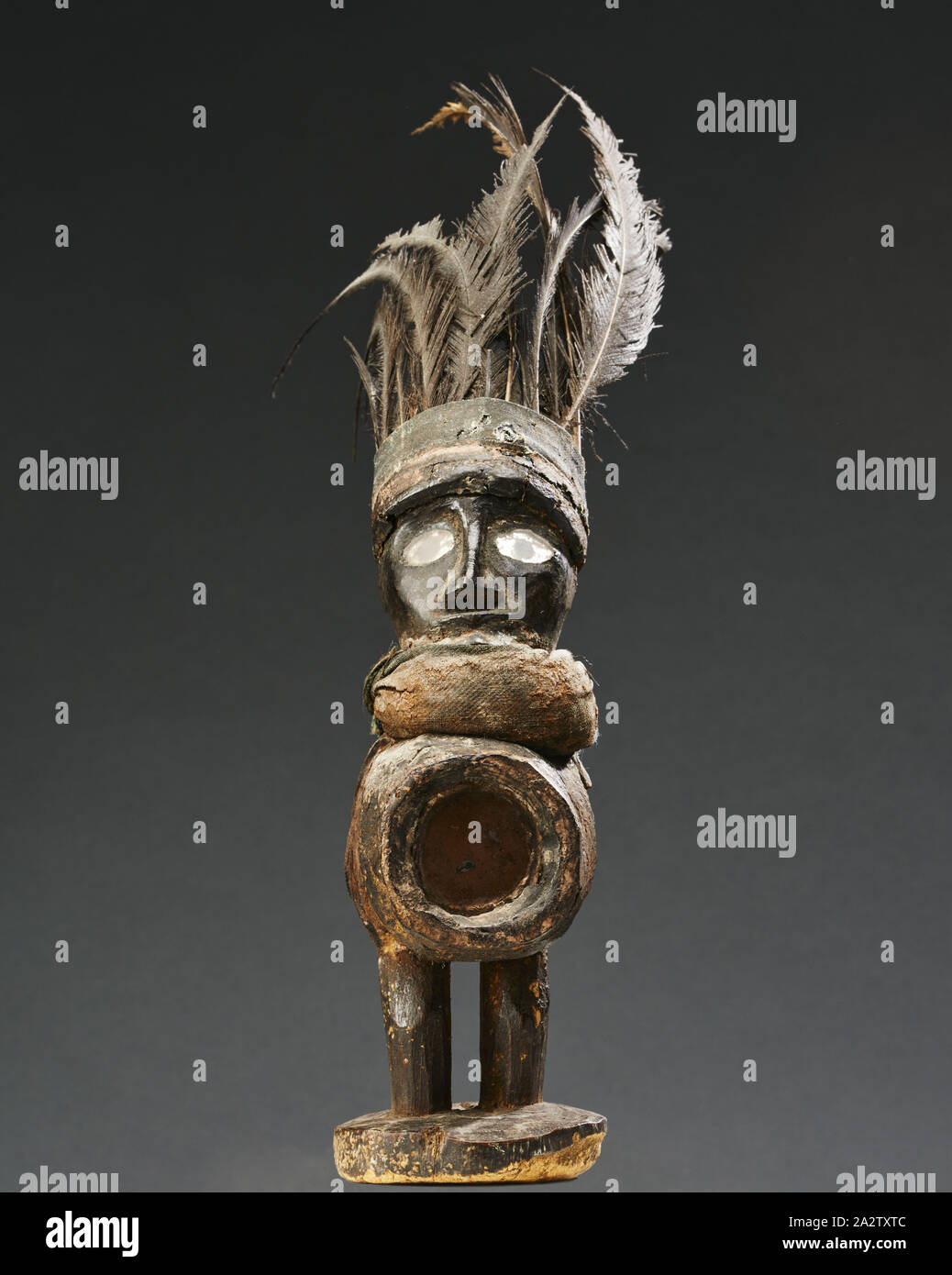 human figure (Nkisi), Yombe people, late 19th century - early 20th century, wood, glass, cloth, resin, feathers, 12-1/2 x 9 x 2-3/4 in. (including feathers), African Art Stock Photo