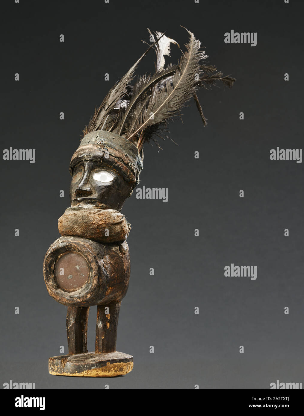 human figure (Nkisi), Yombe people, late 19th century - early 20th century, wood, glass, cloth, resin, feathers, 12-1/2 x 9 x 2-3/4 in. (including feathers), African Art Stock Photo