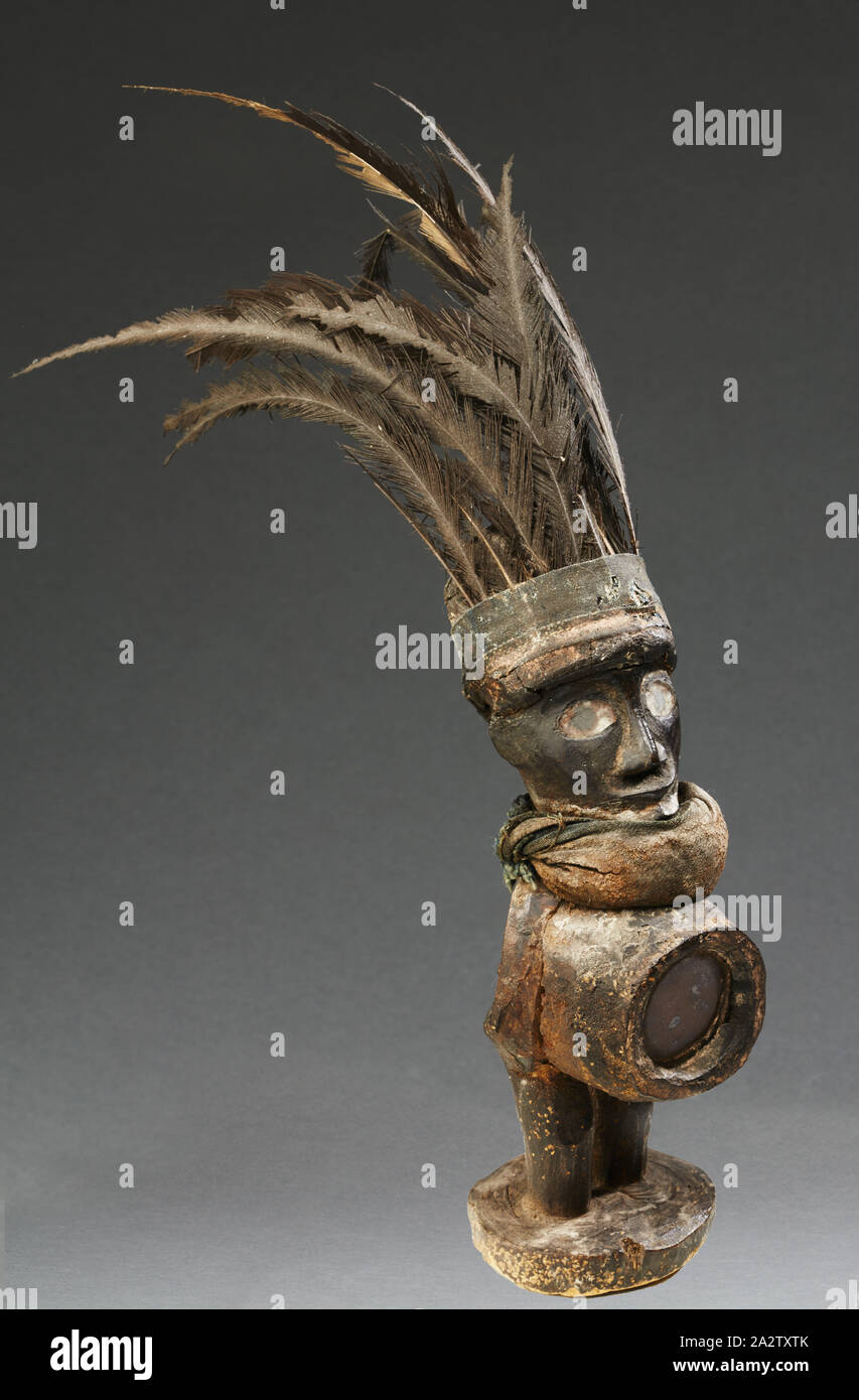 human figure (Nkisi), Yombe people, late 19th century - early 20th century, wood, glass, cloth, resin, feathers, 12-1/2 x 9 x 2-3/4 in. (including feathers), African Art Stock Photo