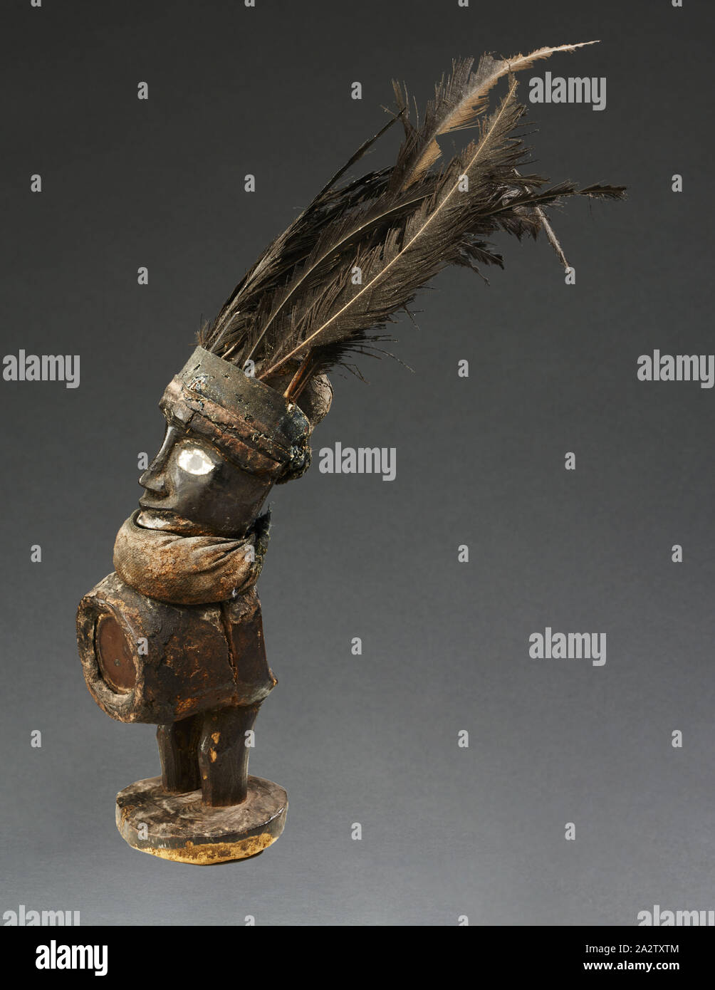 human figure (Nkisi), Yombe people, late 19th century - early 20th century, wood, glass, cloth, resin, feathers, 12-1/2 x 9 x 2-3/4 in. (including feathers), African Art Stock Photo