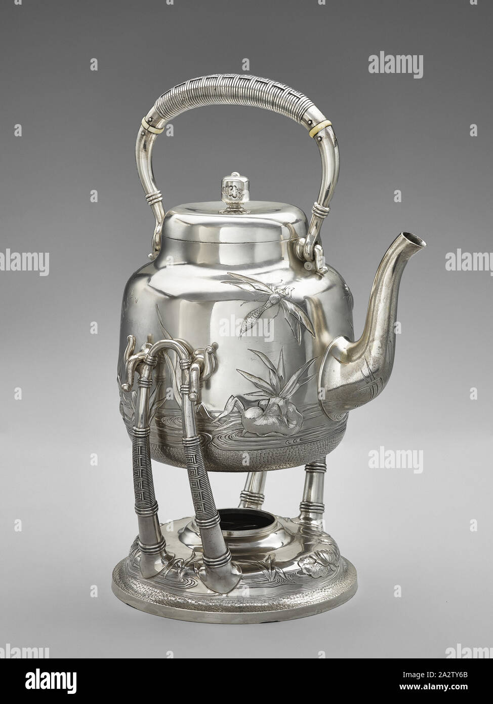 water kettle with lid and stand, Dominick & Haff, Manufacturer (American), Giles Brothers and Company, Retailer (American), 1881, silver, 10-1/2 x 8 x 7 in. (installed, handle at rest) 13 x 8 x 7 in. (installed, handle raised) A) kettle: 6 x 8-1/4 x 6-1/2 in. (handle at rest) 9-1/2 x 8-1/4 x 6-1/2 in. (handle raised) B) lid: 1-3/4 x 3-3/4 x 3-3/4 in. C) stand: 7 x 6-1/2 x 7 in., A) kettle: Inscribed, side, on angle: E.R.S. Stamped, underside: STERLING, 116, GILES BROS & CO., 925, [circle outline], 1881 C) stand: Stamped, underside: STERLING, GILES BROS & CO., Decorative Arts Stock Photo