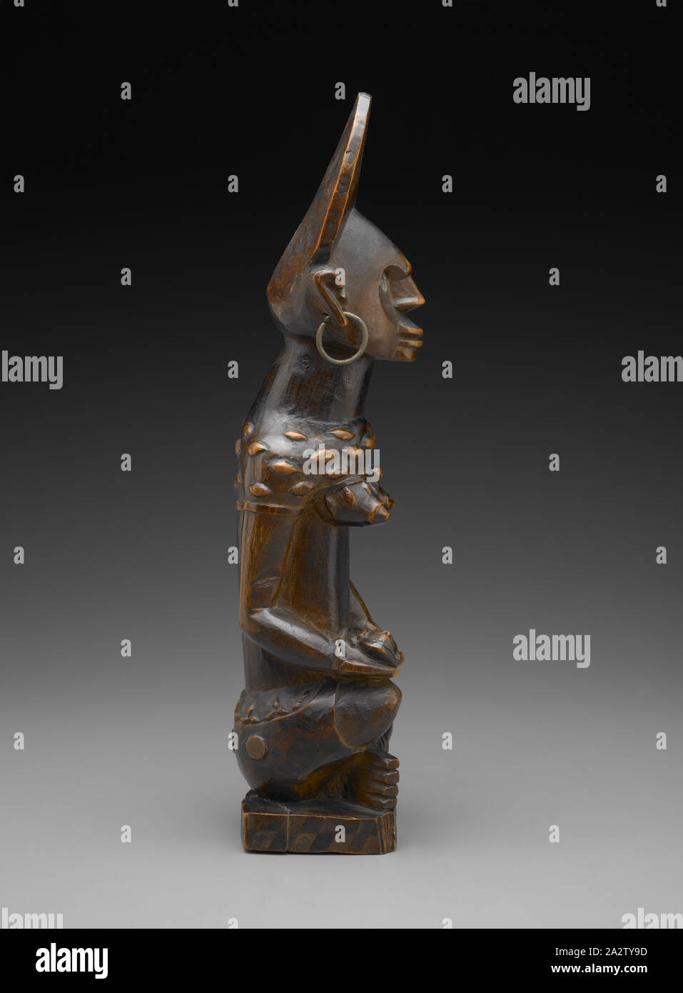 female figure with child (Phemba), Yombe people, late 19th century - early 20th century, wood, brass, glass, 13-1/2 x 4 x 3 in., African Art Stock Photo