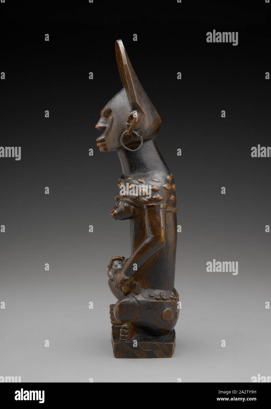 female figure with child (Phemba), Yombe people, late 19th century - early 20th century, wood, brass, glass, 13-1/2 x 4 x 3 in., African Art Stock Photo