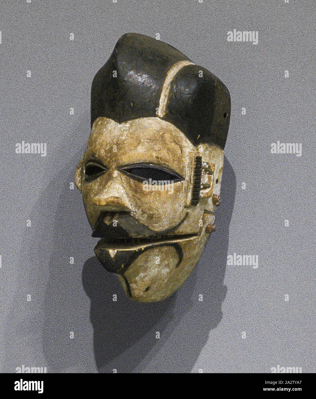 Elu face mask, Ogoni people, 20th century, wood, pigment, fiber, 8-3/4 x 5-1/2 x 5 in., African Art Stock Photo