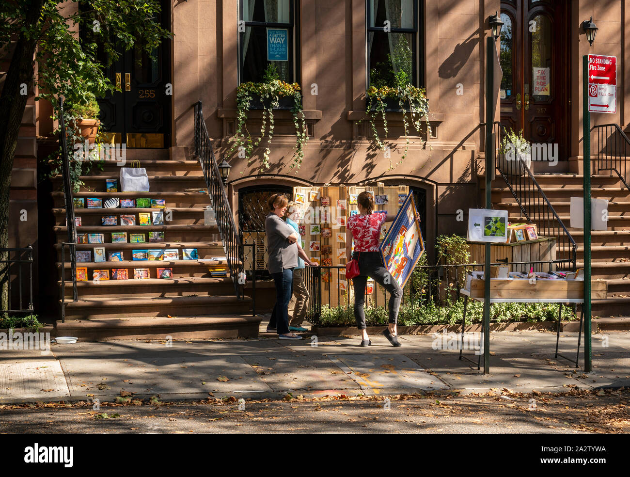Rsidents sell artwork at a stoop sale in Brooklyn in New York on Sunday, September 29, 2019.  (© Richard B. Levine) Stock Photo