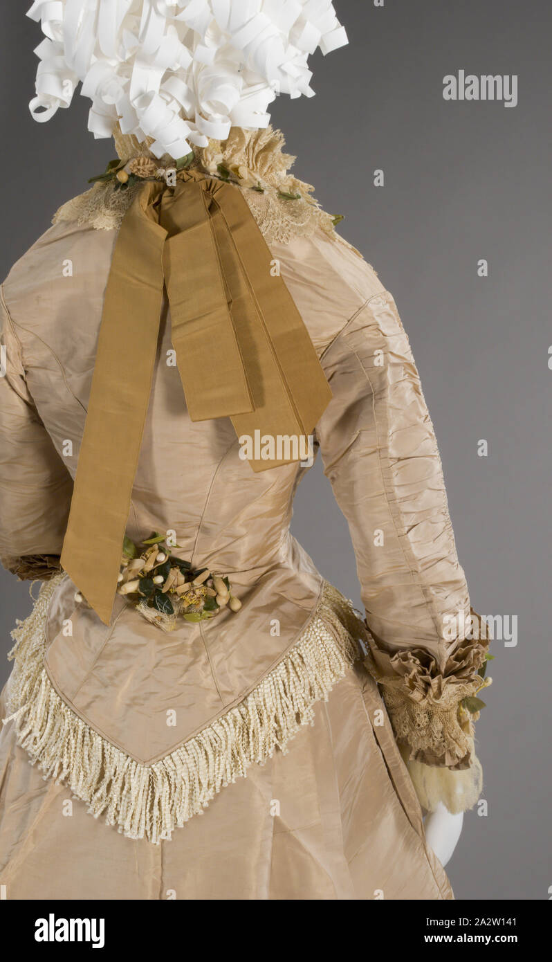 wedding dress, I.W. Caley, Manufacturer, 1875, silk satin, orange blossoms, silk netting with cotton petticoat, skirt: L: 43 in. (front) L: 67 in. (back), bodice: L: 24-1/2 in., Label: I. W. CALEY Dress and Mantle Maker, Norwich, Textile and Fashion Arts Stock Photo