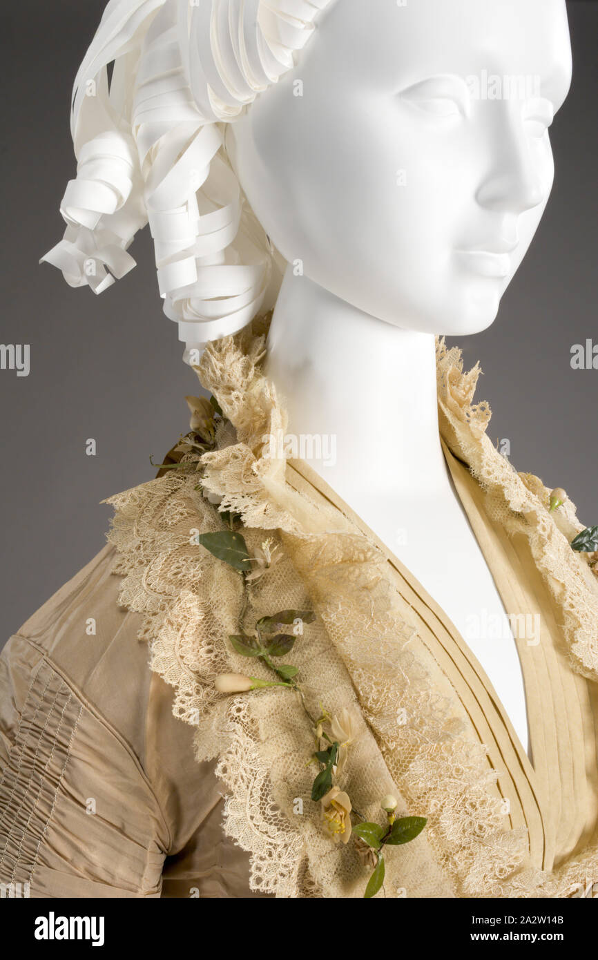 wedding dress, I.W. Caley, Manufacturer, 1875, silk satin, orange blossoms, silk netting with cotton petticoat, skirt: L: 43 in. (front) L: 67 in. (back), bodice: L: 24-1/2 in., Label: I. W. CALEY Dress and Mantle Maker, Norwich, Textile and Fashion Arts Stock Photo