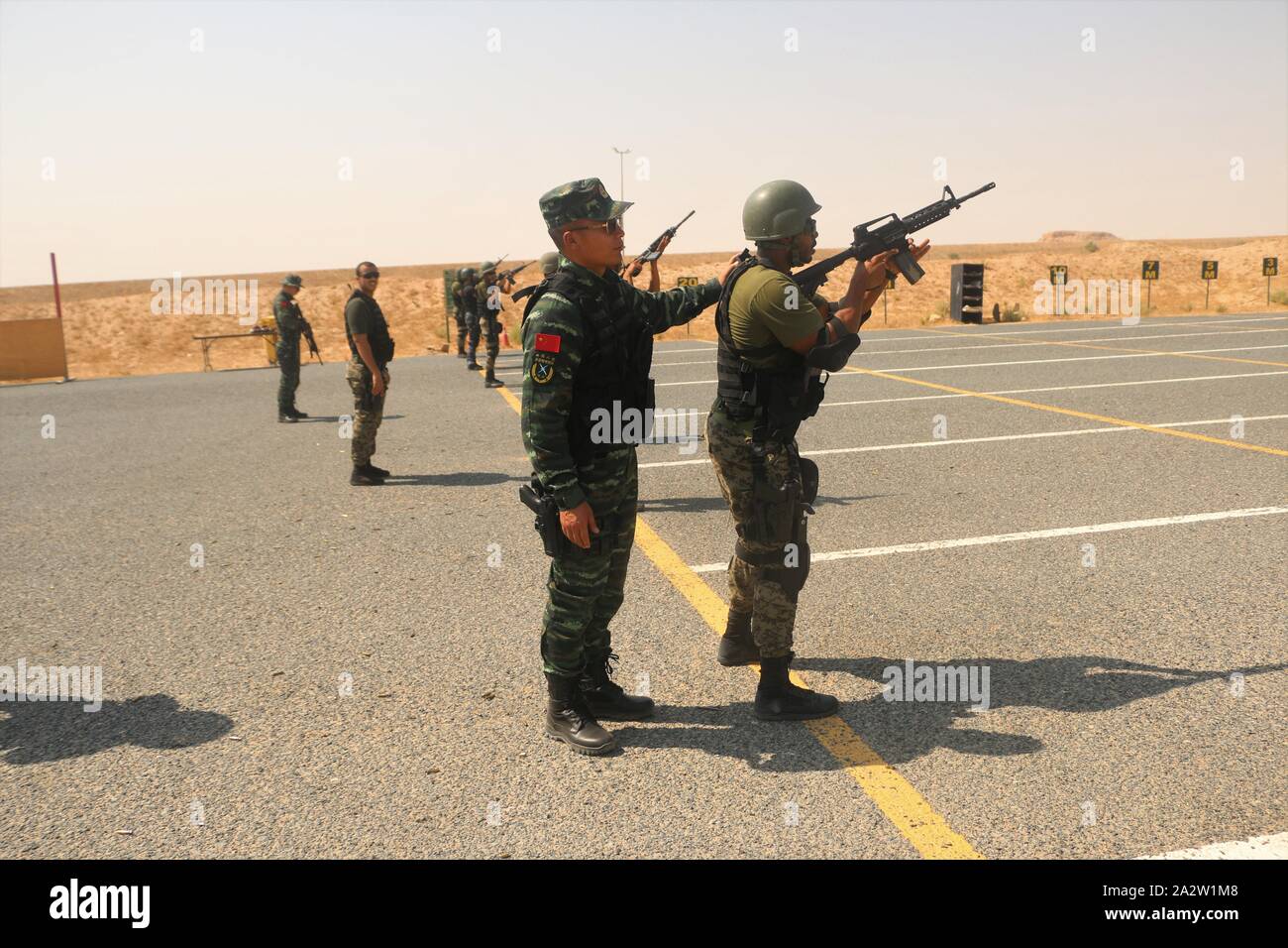 Farwaniya Governorate Kuwait Oct 3 19 Xinhua Chinese People S Armed Police Force Capf Training Group Members Teach Kuwait National Guard Kng Soldiers Shooting Skills In A Military Camp In