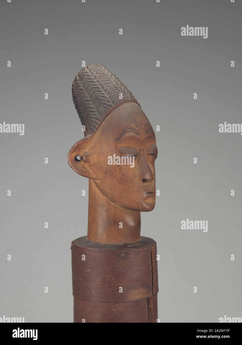 lidded container with human head finial, Songo (Congolese, late 19th century-early 20th century), 1900-1910, wood, bark, pigment, A-C) 20-5/8 x 5 x 5 in. (installed) A) head finial lid: 10-1/4 x 4-1/2 x 4-1/2 in. B) container: 6-1/2 x 3-3/4 x 3-3/4 in. C) base: 6-1/2 x 5 x 5 in., C) Inscribed, Pyro engraved on vertical side of base: Song DekVoi [have not translated DekVoi which is possibly a location or family reference] C) Inscribed in white paint at outer rim of base, Brill collection inventory number: 578, African Art Stock Photo