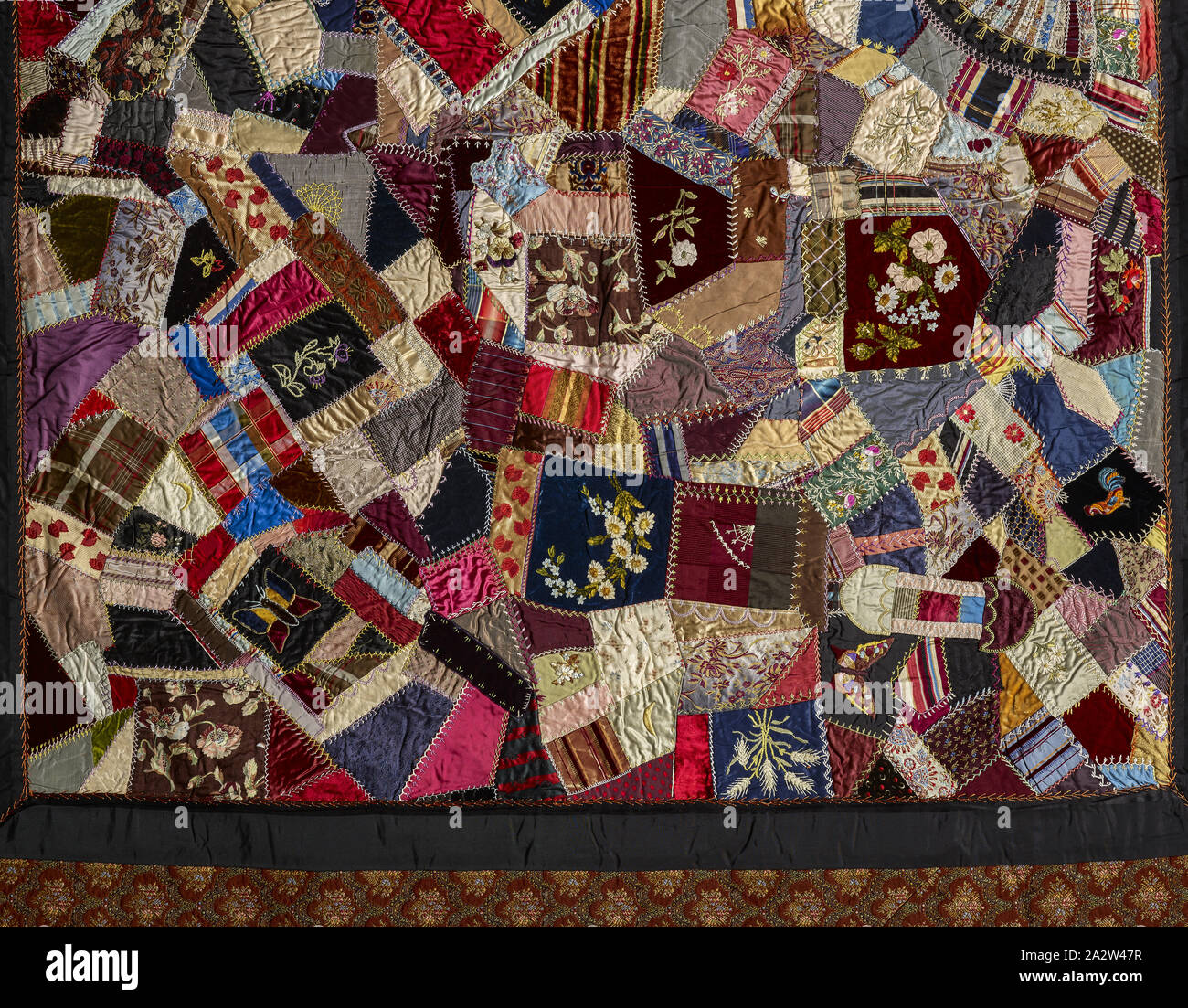 crazy quilt, Unknown, about 1885, silk, velvet, ribbons, synthetic fabric, pieced and embroidered, 85-1/2 x 81-3/4 in., American, Textile and Fashion Arts Stock Photo