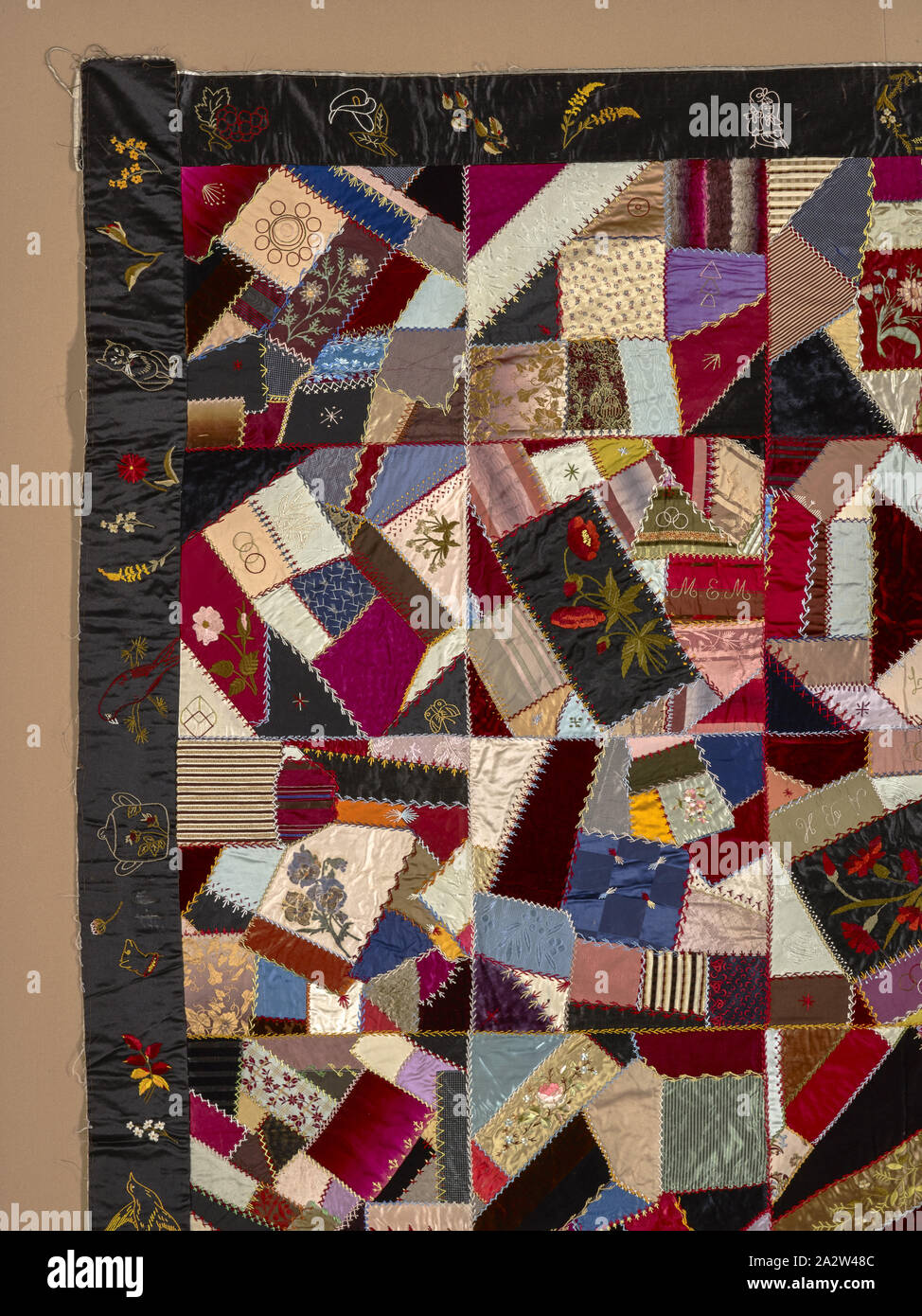 crazy quilt top, Unknown, about 1890, silk and velvet, pieced, embroidered, and painted, 69-1/2 x 70-1/4 in., Sewn, front side, second column from left, second square down: M.E.M. Sewn, front side, third column from left, second square down: L.E.D Sewn, front side, third column from left, third square down, upside down: A.B.H. Sewn, front side, fourth column from left, third square down: E.A.D Sewn, front side, fourth column from left, fourth square down: J.P.M., American, Textile and Fashion Arts Stock Photo