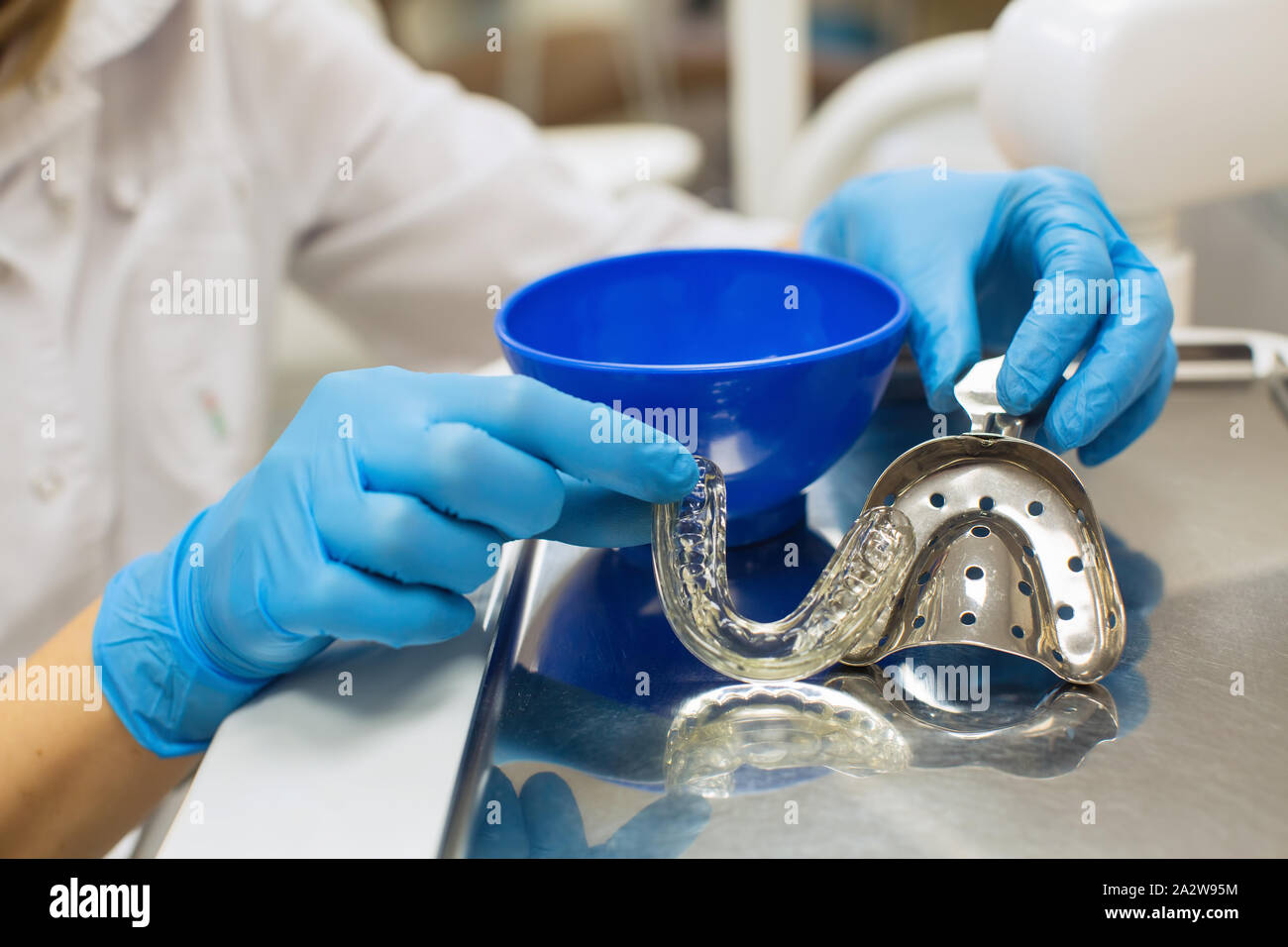 Dentist hands holding removable orthodontic teeth alignment and