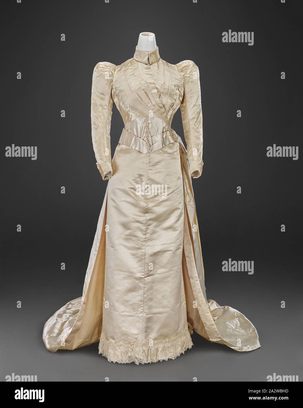wedding gown (bodice, skirt, train), Louis Valentin, Dressmaker (American, born Hungarian, about 1859-1937), 1890, silk, lace, A) bodice: center back 17 in., center front 15 in., bust 30-1/2 in., waist 23-1/2 in., sleeve length 19 in., shoulders 11 in. B) skirt: center back 38-1/2 in., center front 38-1/2 in., waist 19 in., hips 40 in. C) train: 70 x 50 in. D) fabric fragment: 110 x 11-1/4 in. E) fabric fragment: 23-1/2 x 14 in., A) bodice: Label, sewn: Louis Valentin, Boston Label, handwritten and sewn: Mary Addison Bybee, October 15 1890, Indianapolis Indiana, Textile and Fashion Arts Stock Photo