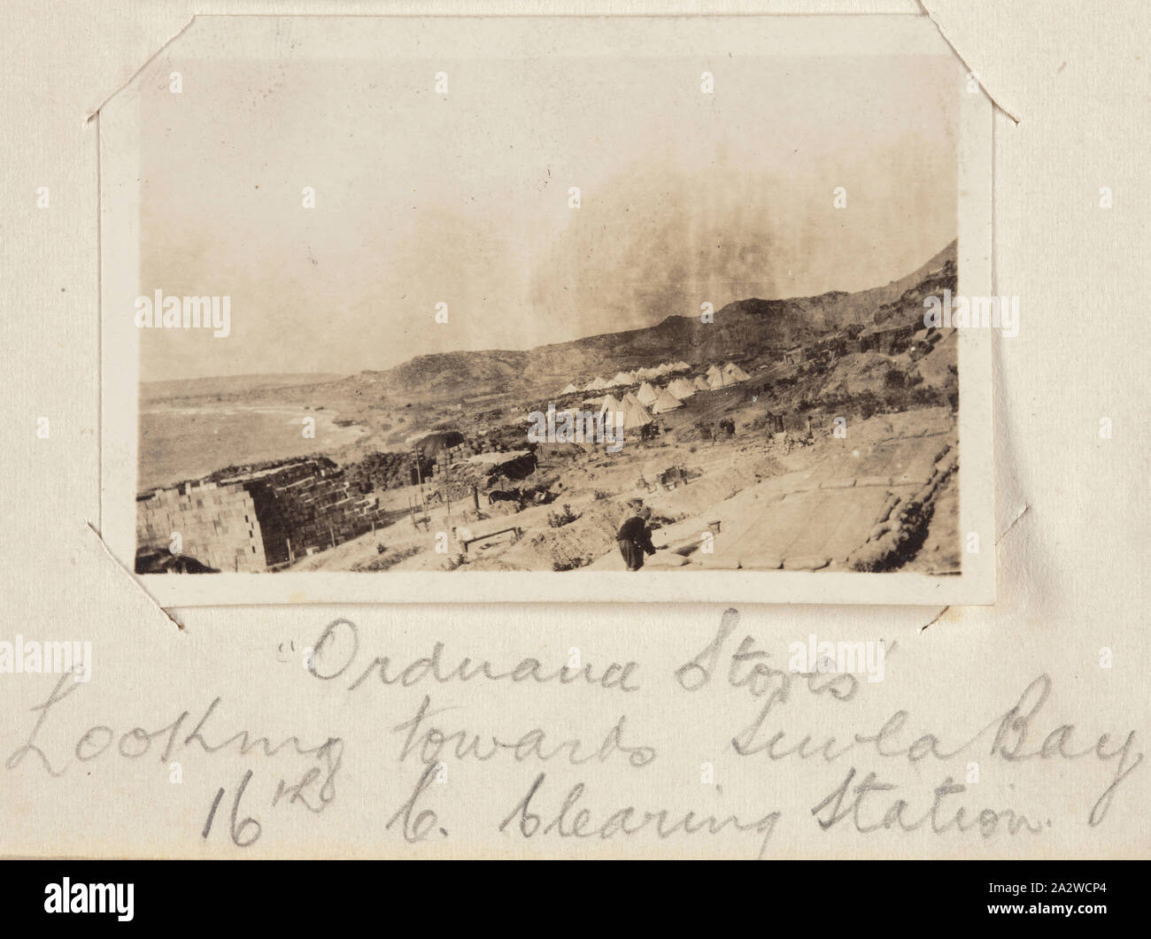Photograph - 'Ordnance Stores', Gallipoli, Turkey, Private John Lord, World War I, 1915, Black and white photographic depicting the Ordnance Store of a camp with Suvla Bay in the background. Attached to a small notebook used as a photograph album, containing 55 black and white photographs of ANZAC soldiers in Egypt, Mudros and Gallipoli during World War I. The photographs were taken by an Australian soldier, Sergeant John Lord or a fellow soldier Stock Photo