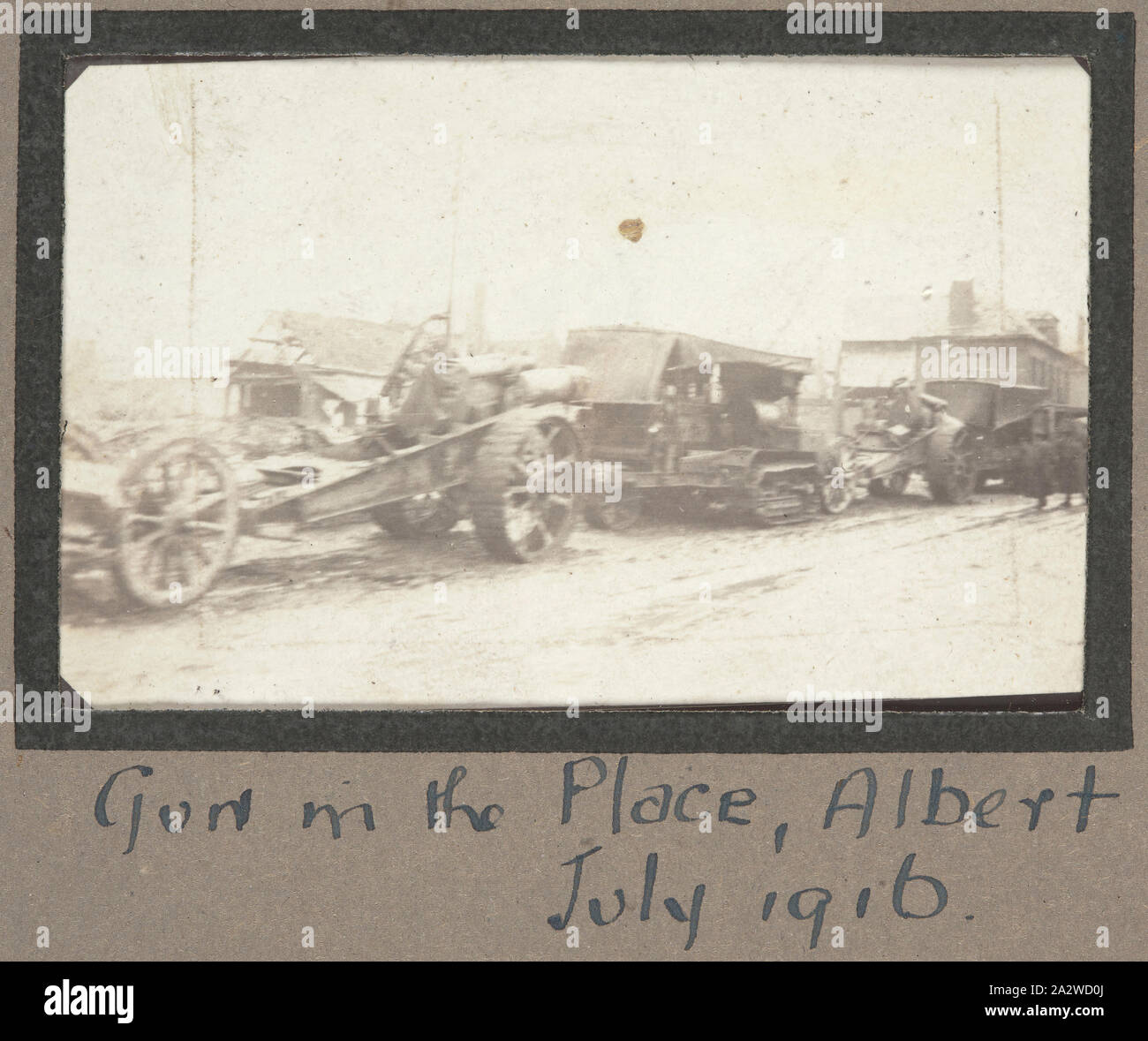 Photograph - Military Guns in Convoy, Albert, France, Sergeant John Lord, World War I, 1916, Photographic print which depicts a convoy of military vehicles standing stationary along a street in Albert. The small French town of Albert was used by the Allied forces during 1916 as the major control centre for the planning of the Battle of the Somme. The headquarters of the Australian divisions were also temporarily based at Albert due to the heavy fighting that was taking place close by Stock Photo