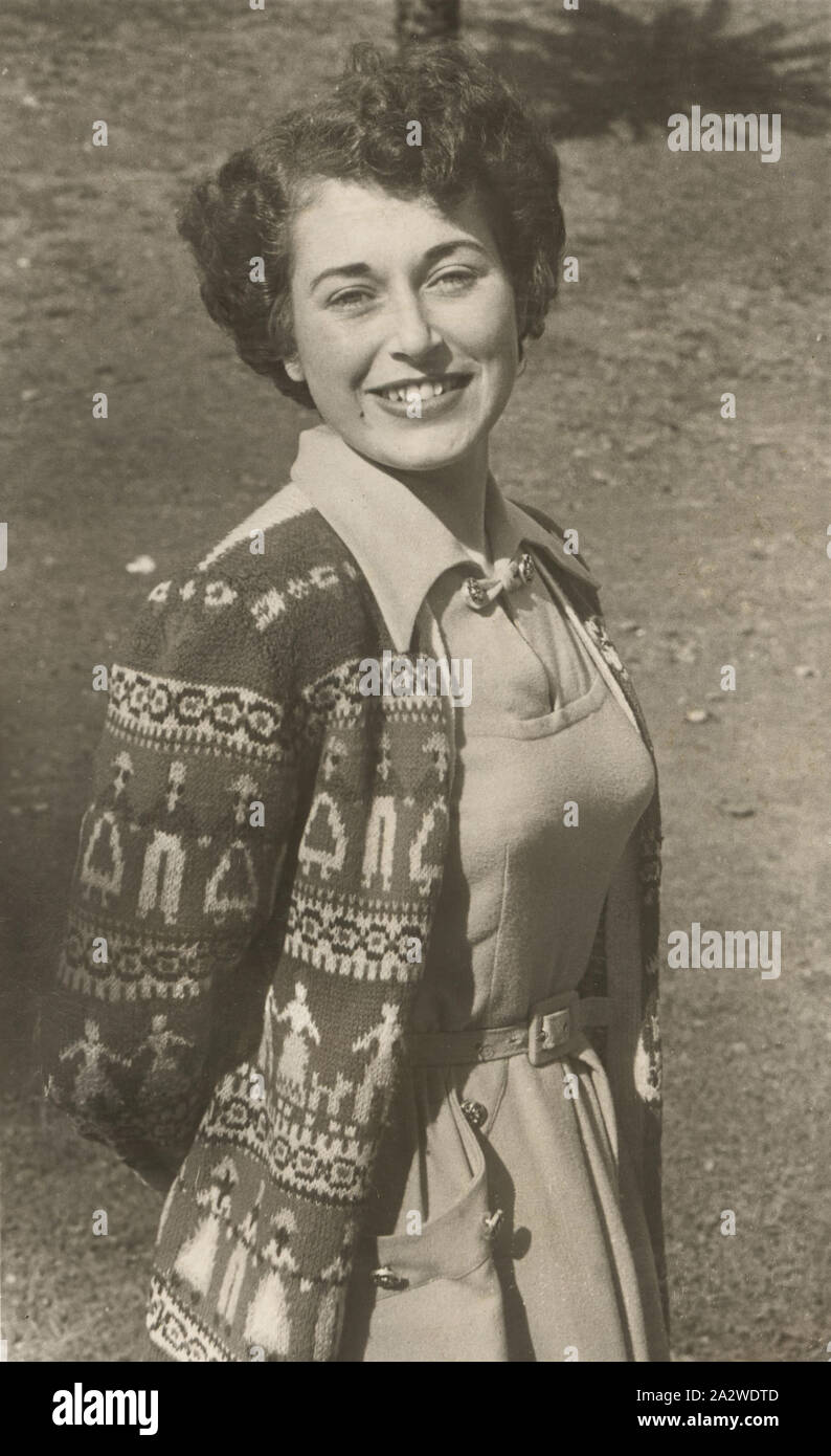 Photograph - Bernice Kopple in Cardigan, Australia, 1950s, Photograph of Bernice Kopple, three-quarter portrait view, in a patterned cardigan and collared dress. In the 1950s and 1960s Bernice Kopple worked as a performer on the Tivoli Circuit. Bernice Kopple was born in Glasgow, Scotland in 1930 and migrated to Melbourne onboard the ship New Australia in 1950. She was nineteen years old and travelled alone, her mother and three siblings following later Stock Photo