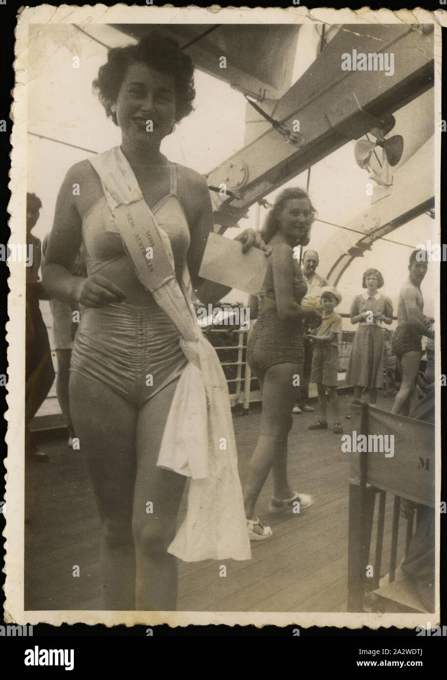 Photograph - Bernice Kopple 'Miss New Australia', New Australia, 1950, Photograph of Bernice Kopple deckside onboard the ship New Australia after winning the Miss New Australia beauty competition during her migrant voyage from Scotland to Australia, December 1950. The 'Miss New Australia' sign pinned to her sash is also in the Museum's collection. Bernice Kopple was born in Glasgow, Scotland in 1930 and migrated to Melbourne onboard the ship New Australia in 1950 Stock Photo