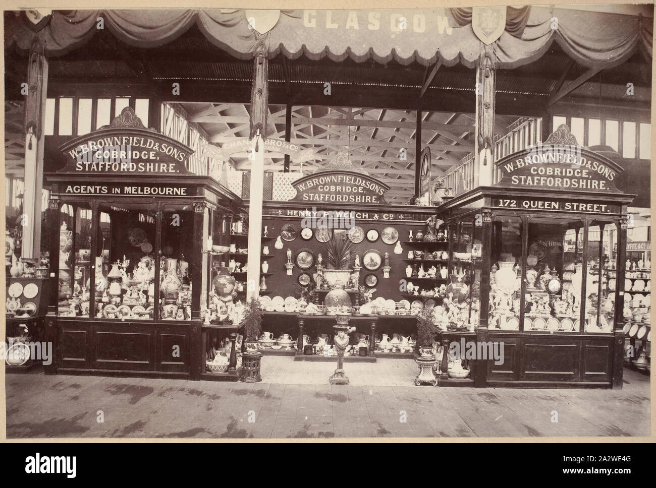 Photograph - British Court, Main Avenue, Exhibition Building, 1880-1881, View of the ceramic displays of W. Brownfield & Sons of Staffordshire, in the British Court on the western side of the temporary annexe's main avenue during the 1880 Melbourne International Exhibition held at the Exhibition Buildings, between 1 October 1880 and 30 April 1881. Brownfield & Sons had their display next to the other reputable British ceramic firm, Mintons, and like them, their Stock Photo