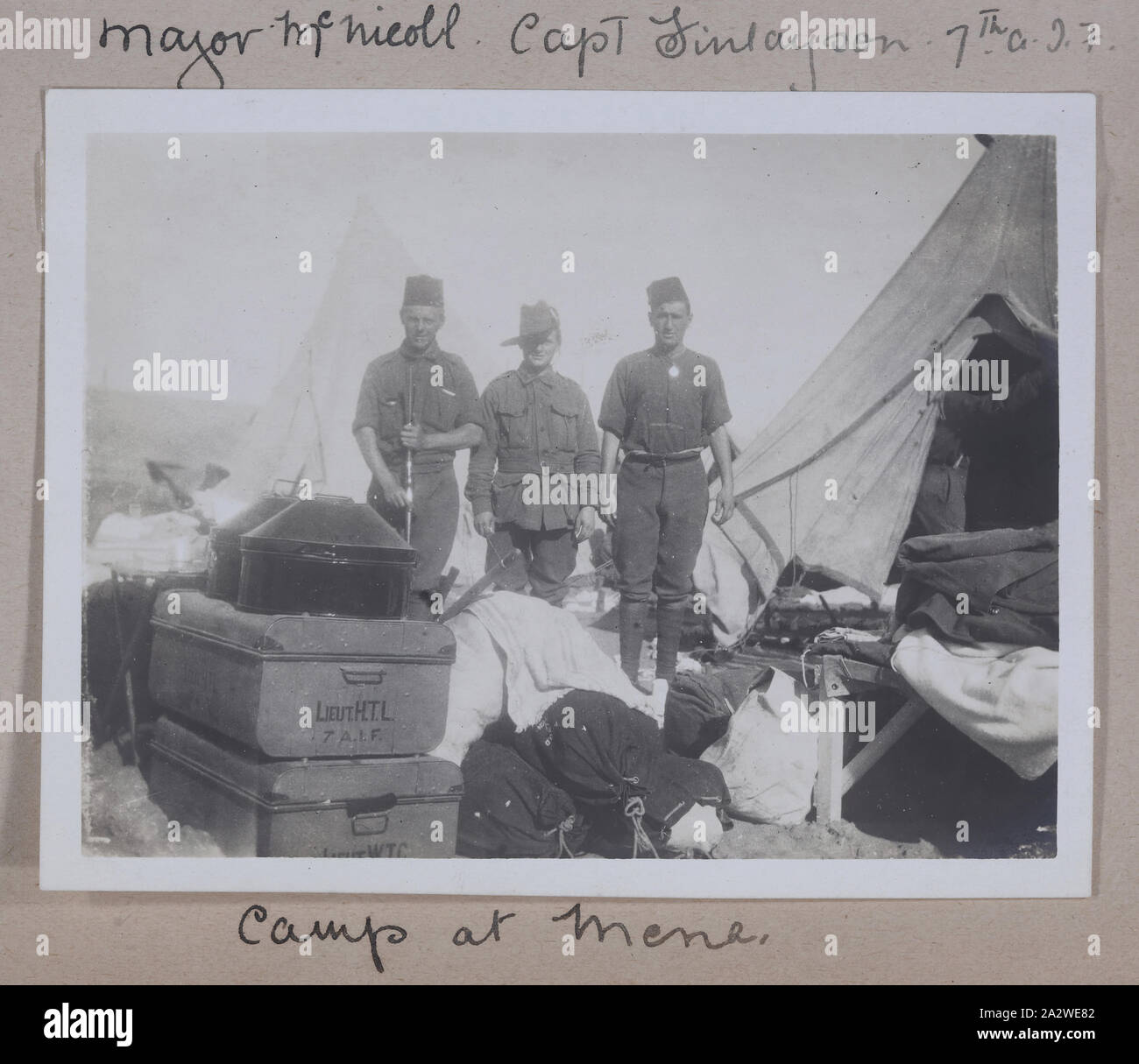Photograph - 'Camp at Mena', Egypt, Captain Edward Albert McKenna, World War I, 1914-1915, One of 139 photographs in an album from World War I likely to have been taken by Captain Edward Albert McKenna. The photographs include the 7th Battalion training in Mena Camp, Egypt, and sight-seeing. Image depicting three men standing in what appears to be a tent being aired at Mena Camp. Mena Camp was one of three training camps in Egypt used by the A.I.F. and the N.Z.E.F Stock Photo