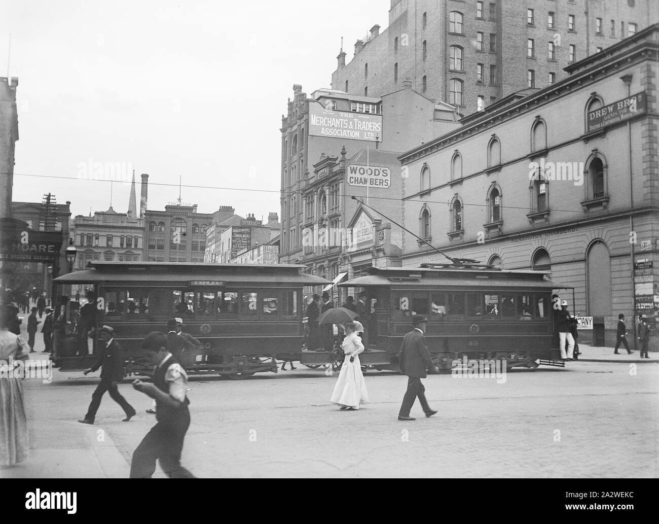 Glass Negative - City Tram, Sydney, circa 1900s, Black and white 1/4 plate glass negative featuring a tram on a busy street in Sydney city, circa 1900s. This is one of twelve negatives originally housed in an Imperial Special Rapid Plates box featuring scenes in Sydney and a picnic at an unknown location, presumably in New South Wales or Victoria. The provenance of these images is unclear, but they were housed in the Kodak Museum in a box Stock Photo
