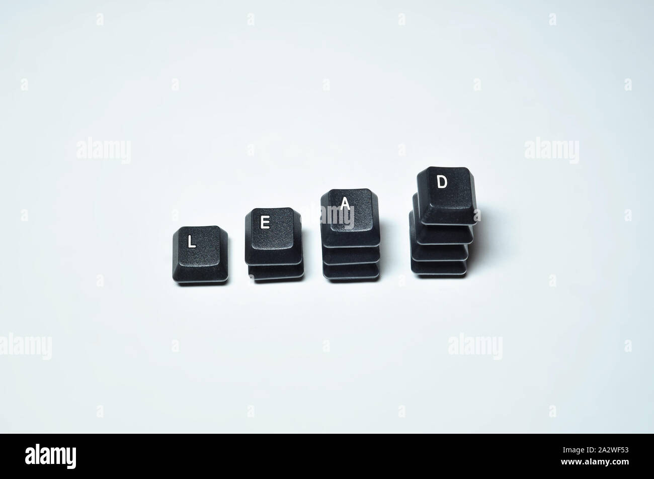 Keys taken from keyboard to form the word LEAD, steps in leadership