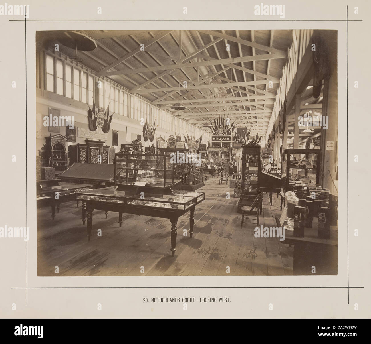 Photograph - Dutch Court, Temporary Annexe, Exhibition Building, 1880-1881, View looking westwards of the interior of the Dutch Court in the central temporary annexe on the eastern side of the main avenue at the 1880 Melbourne International Exhibition held at the Exhibition Buildings, Carlton Gardens, between 1 October 1880 and 30 April 1881. In addition to the main permanent Exhibition Building, two permanent annexes as well as a large, central wooden temporary annexe Stock Photo