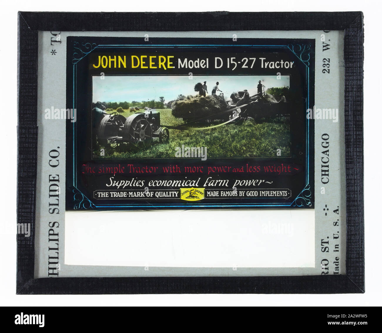 Glass Advertising Slide - John Deere Tractor, United State of America, circa 1930, Colour glass slide advertisement featuring a John Deere Model D15-27 tractor. .It was made by Phillips Slide Co., Chicago, USA, circa 1930 for cinema use Stock Photo