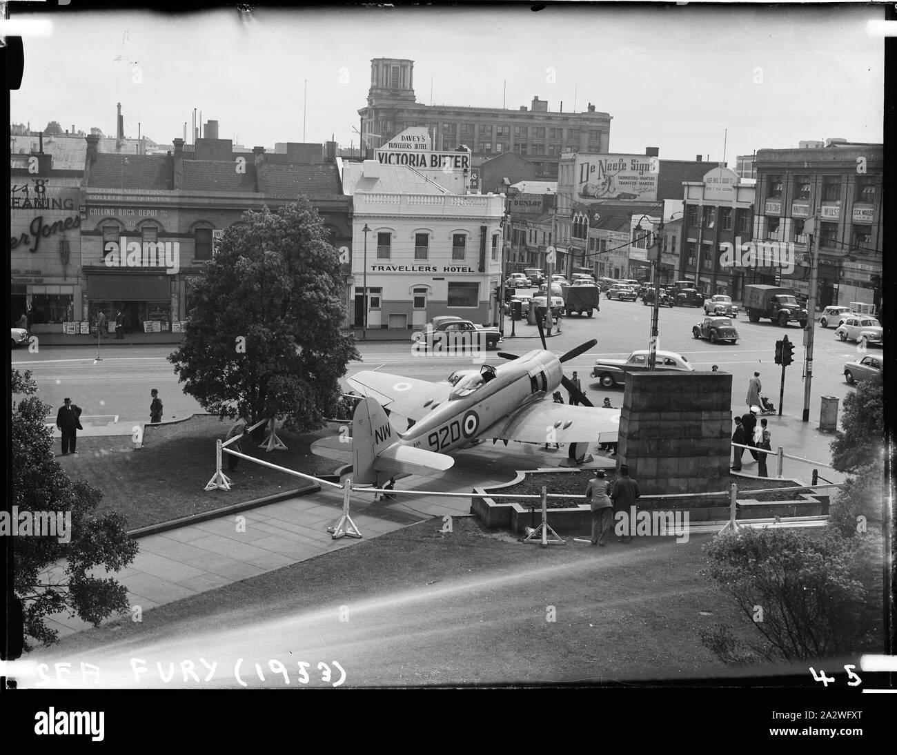 Glass Negative - Sea Fury Military Bomber Aircraft, Museum of Applied Science of Victoria (Science Museum), Melbourne, 1953, Photograph of the Royal Australian Navy's Sea Fury Aircraft outside the Museum of Applied Science of Victoria, corner of Swanston and Bourke Street, 1953. The Sea Fury was loaned by the Royal Australian Navy for the Jubilee of Flight Exhibition. The exhibition commemorated fifty years of aviation, and was open from Dec 10 1953 to Feb 1954 Stock Photo