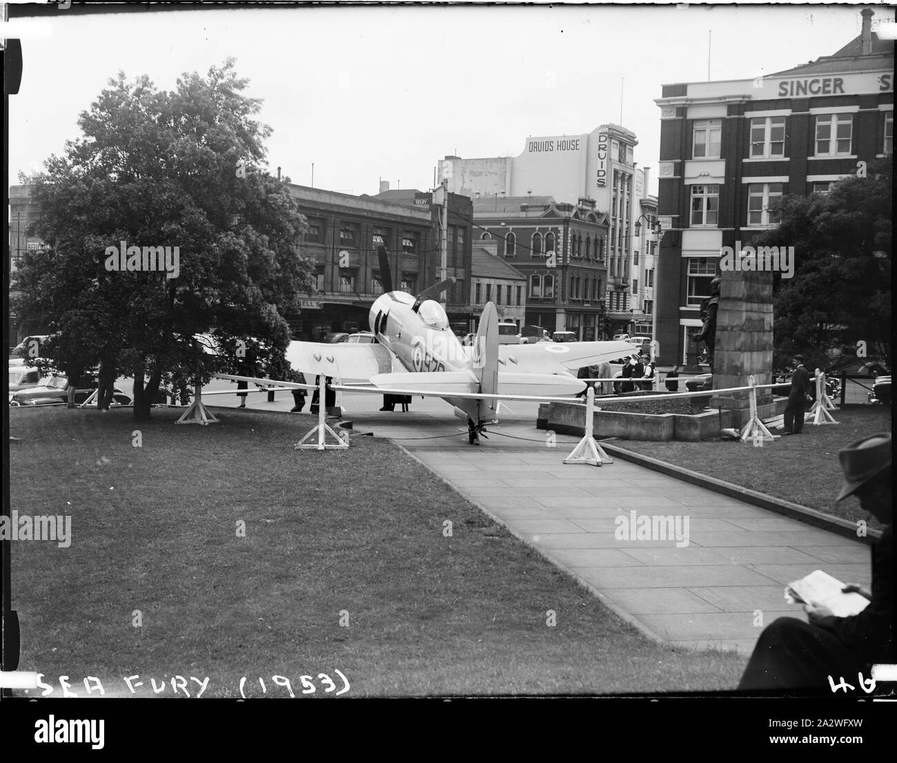 Glass Negative - Sea Fury Military Bomber Aircraft, Museum of Applied Science of Victoria (Science Museum), Melbourne, 1953, Photograph showing rear view of the Royal Australian Navy's Sea Fury Aircraft outside the Museum of Applied Science of Victoria, corner of Swanston and Bourke Street, 1953. The Sea Fury was loaned by the Royal Australian Navy for the Jubilee of Flight Exhibition. The exhibition commemorated fifty years of aviation, and was open from Dec 10 1953 to Feb 1954 Stock Photo