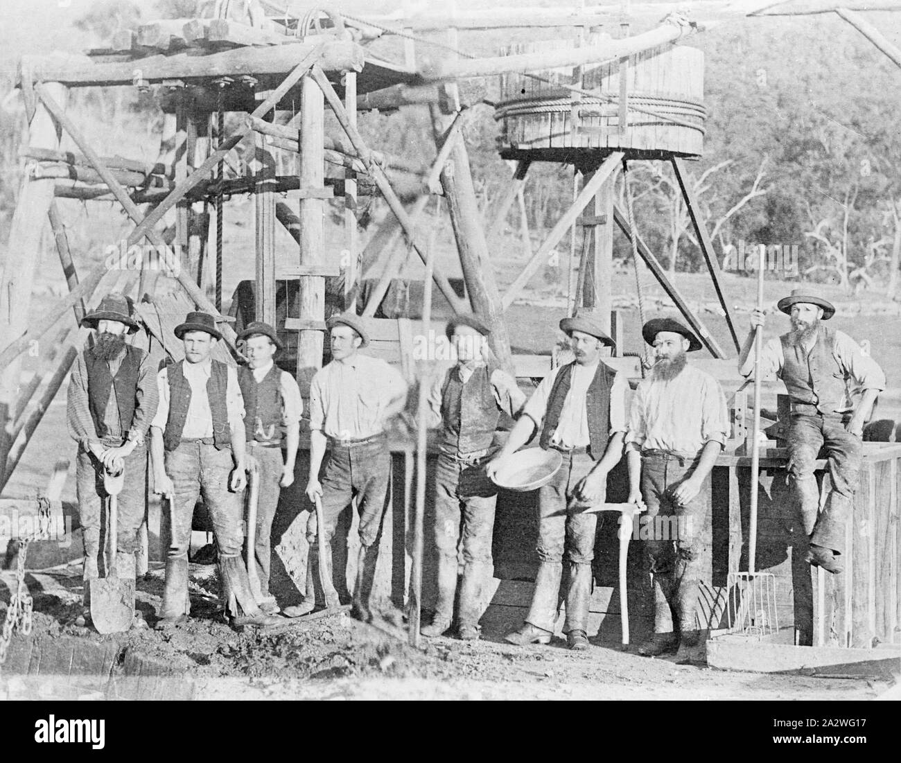 Negative - Miners in Front of Horse Whim & Mine Shaft Poppet Head, Glenpatrick, Victoria, circa 1880, A group of miners at a mine. A whim is in the background Stock Photo