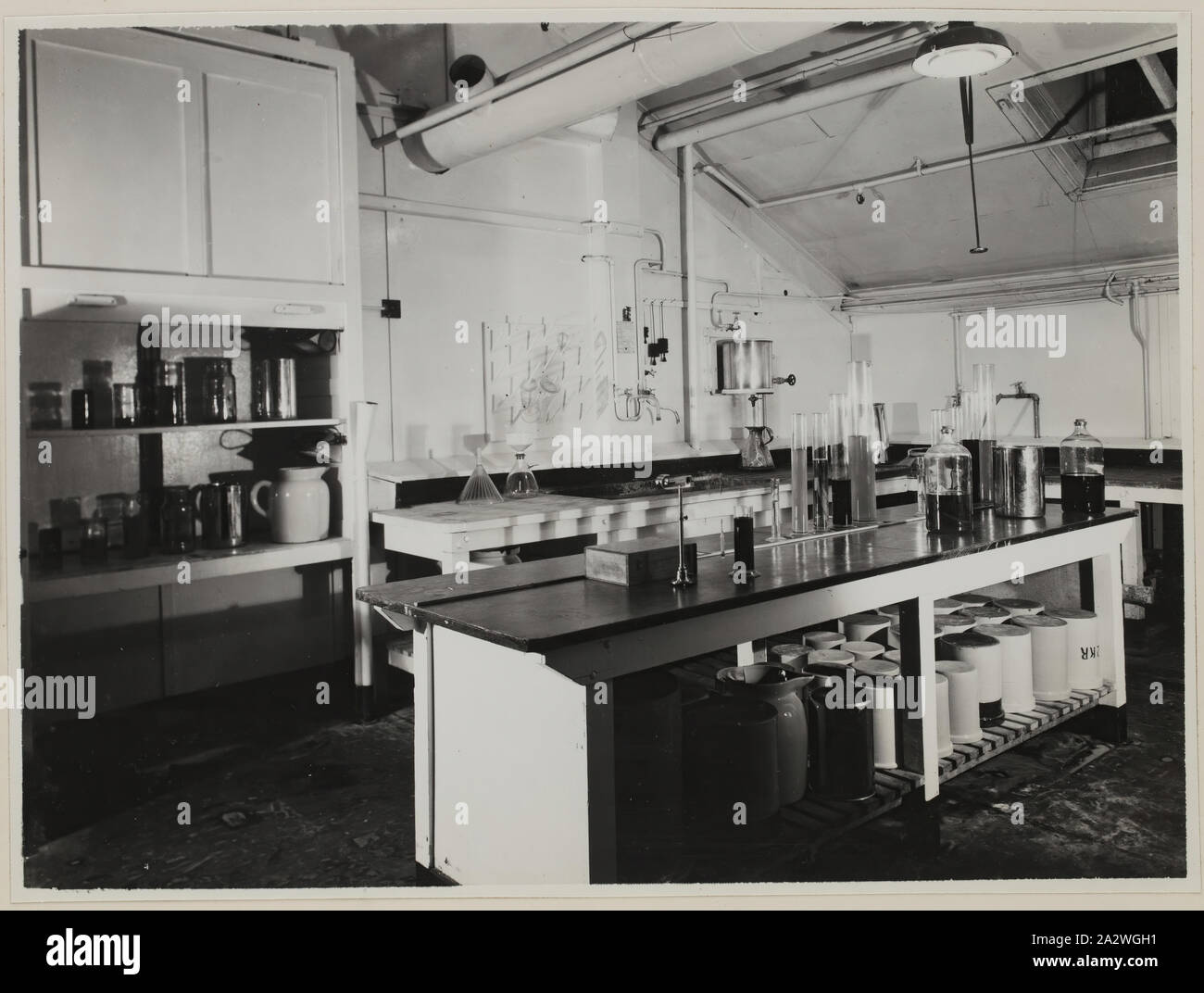 Photograph, Doctor Room, Abbotsford, pre 1946., Monochrome photograph of the doctor room at Kodak Australasia Pty Ltd, Abbotsford, showing the servery to the melting room. an album produced by Kodak, titled 'Emulsion Department: Production and Experimental'. It belonged to Ian 'Charlie' Yelland, who worked for Kodak Australasia Emulsion Department for 46 years, retiring in 1978. the Kodak Heritage Stock Photo