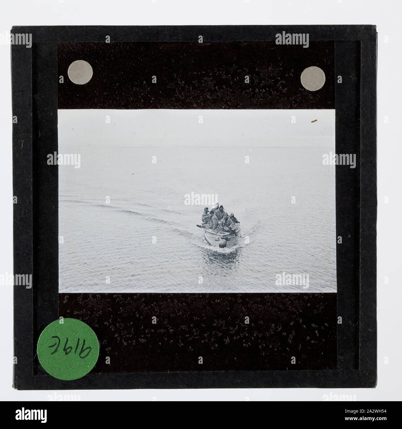 Lantern Slide - A Motor Boat Party from the Discovery II, Ellsworth Relief Expedition, Antarctica, 1935-1936, Lantern slide of a motor boat party from the ship Discovery II, Antarctica. One of 328 images in various formats including artworks, photographs, glass negatives and lantern slides Stock Photo