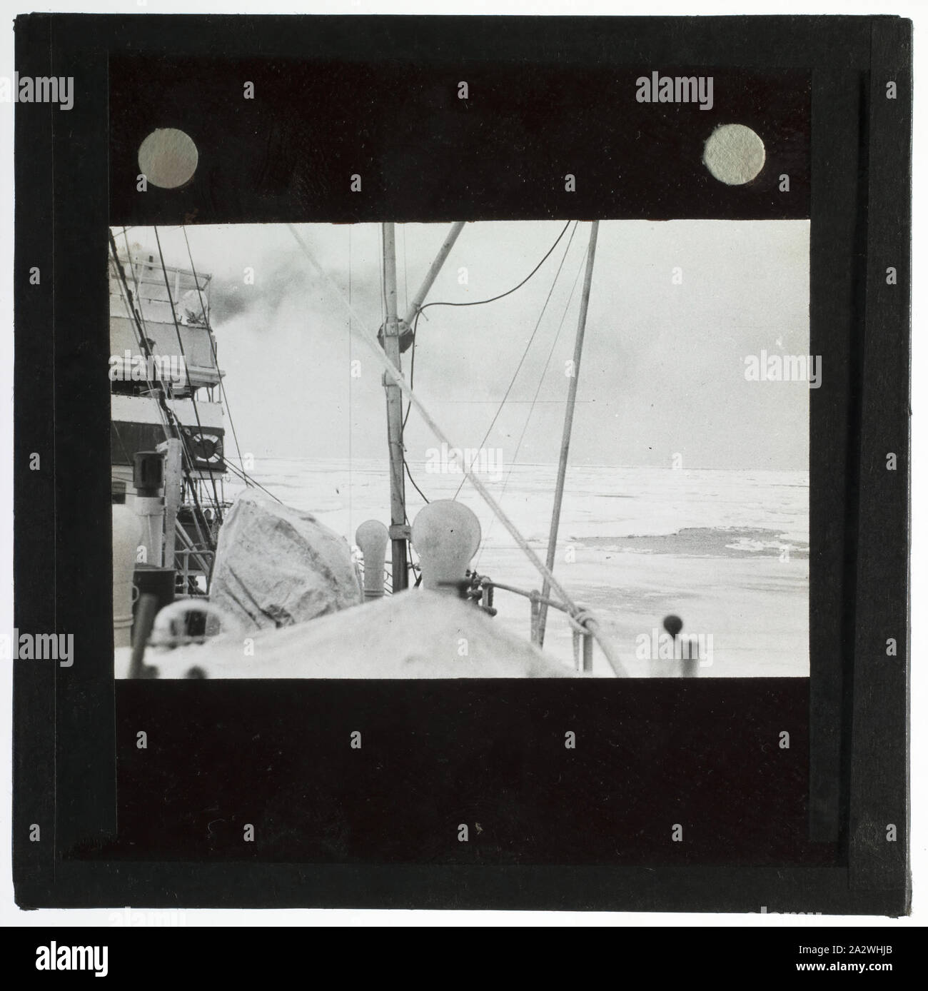 Lantern Slide - Discovery II in Heavy Pack Ice, Ross Sea, Ellsworth Relief Expedition, Antarctica, 1935-1936, Lantern slide of the ship Discovery II in pack ice, Antarctica. One of 328 images in various formats including artworks, photographs, glass negatives and lantern slides Stock Photo