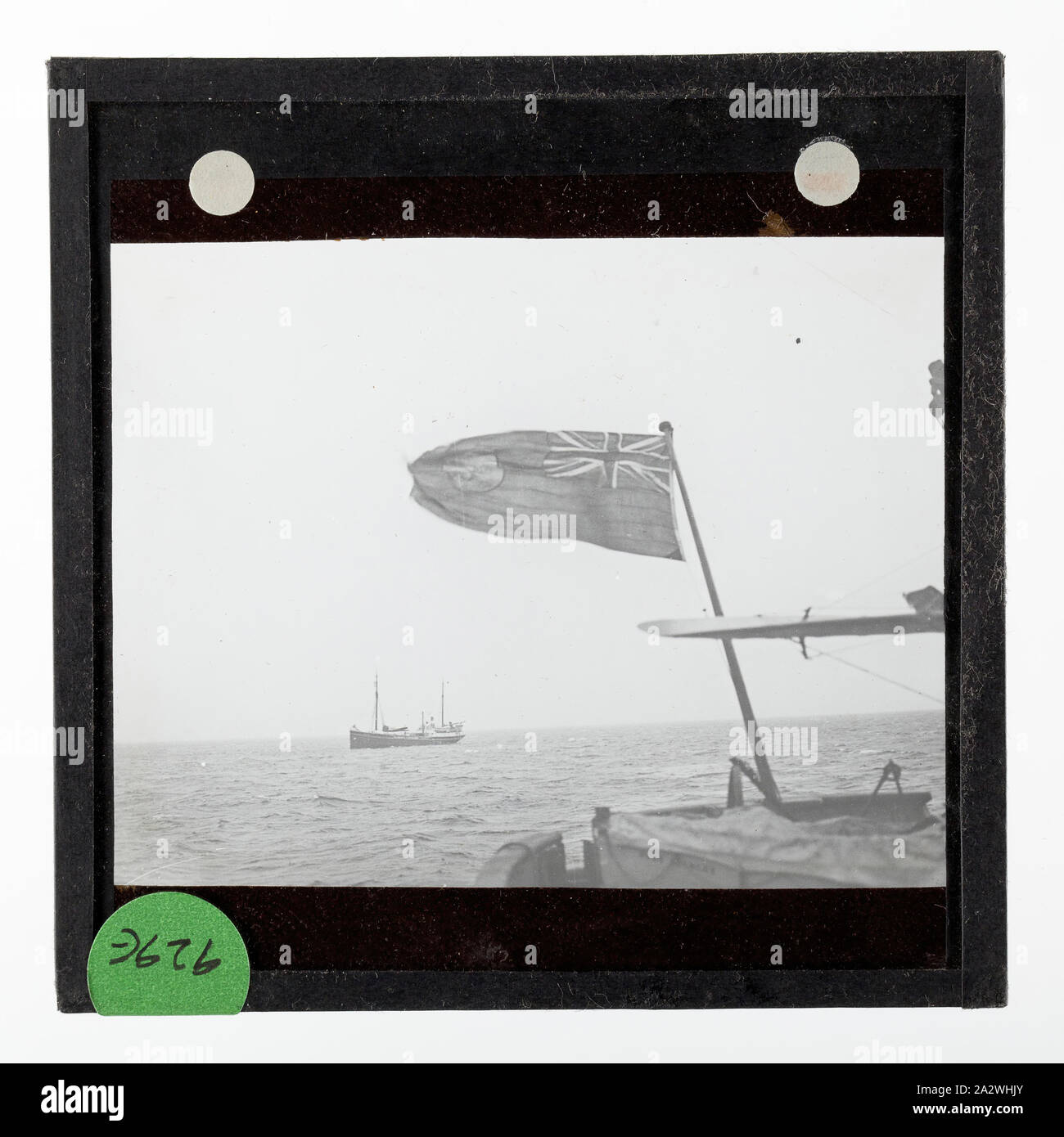 Lantern Slide - Discovery II & the Wyatt Earp, Bay Of Whales, Ellsworth Relief Expedition, Antarctica, 20 Jan 1936, Lantern slide of Discovery II & the Wyatt Earp, Bay Of Whales, Ellsworth Relief Expedition, Antarctica. One of 328 images in various formats including artworks, photographs, glass negatives and lantern slides Stock Photo