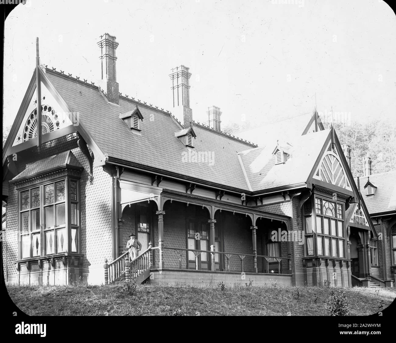 Lantern Slide - Invermay, The Basin, Victoria, circa 1920, Black and white image of the house Invermay built in 1892 by Sir Matthew Davies in The Basin, part of the Dandenongs, using some of the first machine made bricks in the colony and split timber walls transported to the building site on a purpose built railway. Miss Helen Simpson bought the property about the turn of the century when she renamed it Doongalla, added stables and established a fine Stock Photo