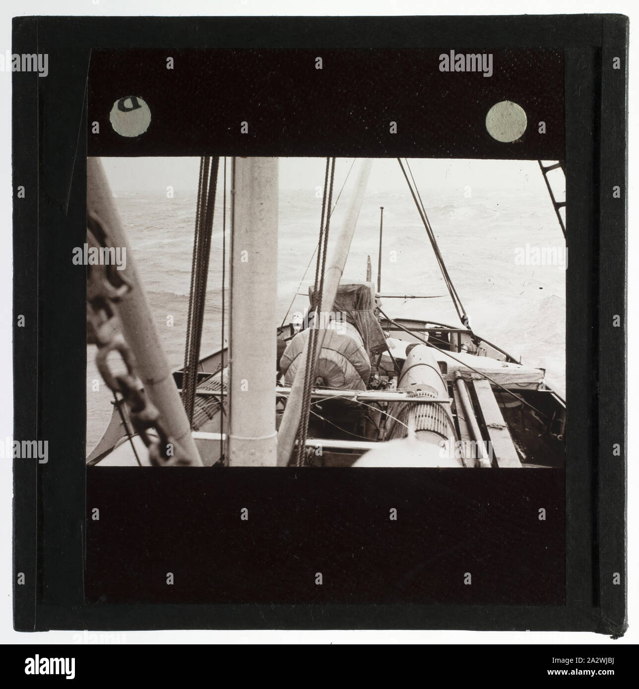 Lantern Slide - RAAF Wapiti A5-37 Stowed at the Stern, Discovery II, Ellsworth Relief Expedition, Antarctica,1936, Lantern slide of RAAF Wapiti A5-37 on the ship Discovery II, Antarctica. One of 328 images in various formats including artworks, photographs, glass negatives and lantern slides Stock Photo