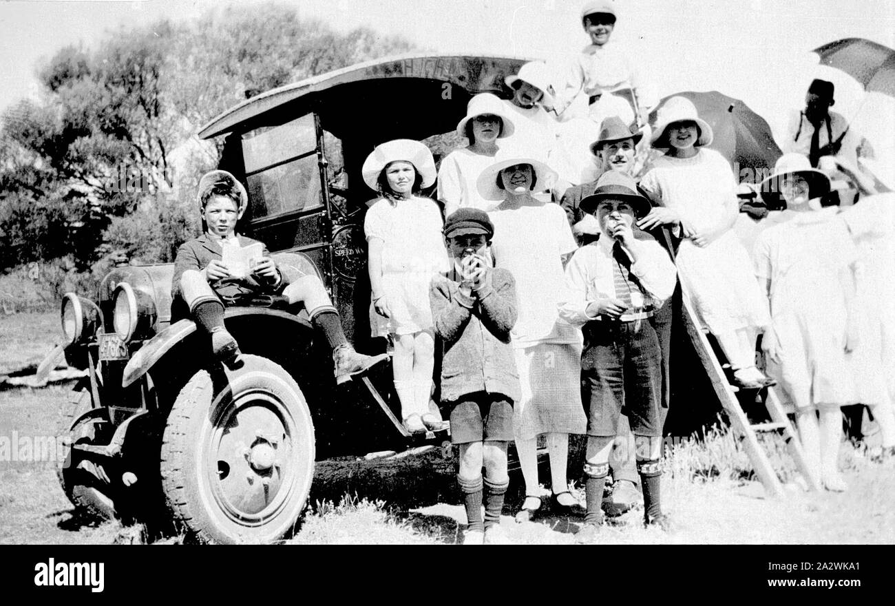 Negative - Mildura District, Victoria, circa 1925, A Sunday school group leaving for a picnic. They are seated on and beside a Reo Speed Wagon truck Stock Photo