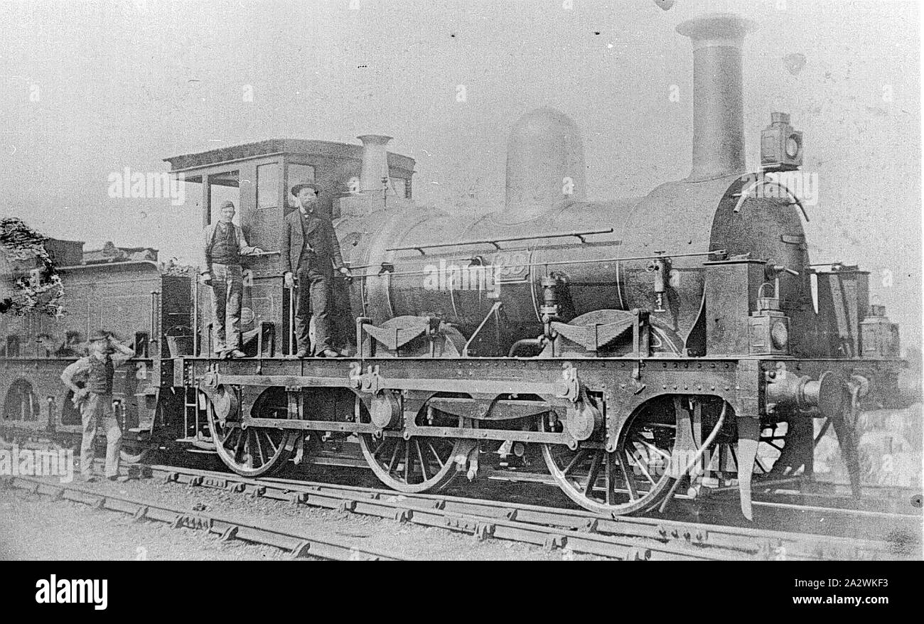 Negative - Crew Posed on O Class 0-6-0 Type Steam Locomotive No.23, Victoria, circa 1870, A loco crew and another man posed on O class 0-6-0 type steam locomotive No.23, built by Slaughter, Gruning & Co, Bristol. This locomotive suffered a boiler explosion on 28 August 1873 at Telegraph Hill near Geelong Stock Photo
