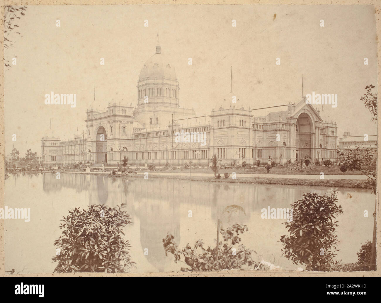 Photograph - Main Exhibition Building from Eastern Entrance, Nicholson Street, Carlton, 1880-1881, View of the main Exhibition Building from the south-east near Nicholson Street at the time of the 1880 Melbourne International Exhibition held at the Exhibition Buildings, between 1 October 1880 and 30 April 1881. Although the Exhibition Building itself had only been recently constructed, the foundation stone being laid in February 1879, the gardens themselves include more mature plants that were Stock Photo