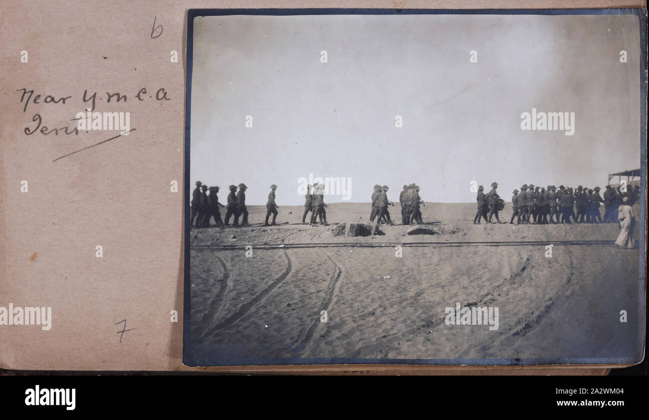 Photograph - 'Near Y.M.C.A. Tent', Egypt, Captain Edward Albert McKenna, World War I, 1914-1915, One of 139 photographs in an album from World War I likely to have been taken by Captain Edward Albert McKenna. The photographs include the 7th Battalion training in Mena Camp, Egypt, and sight-seeing. Image depicting a group of servicemen marching near the Y.M.C.A. tent at Mena Camp. Mena Camp was one of three training camps in Egypt that were used by the A.I.F. and the N.Z.E.F Stock Photo