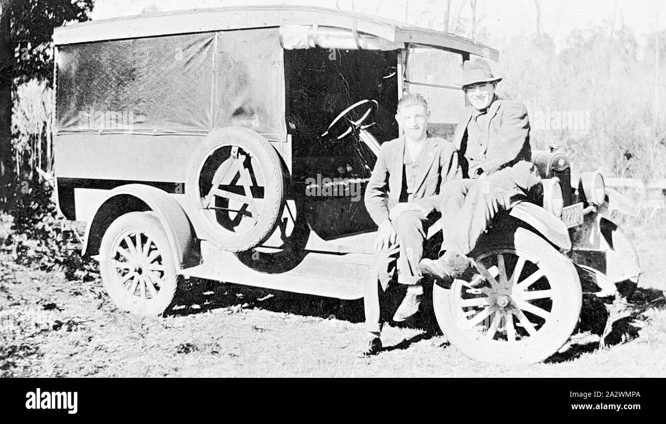 Negative - Men Sitting on Mudguard of a Truck Belonging to Breakell Bakers, Victoria, circa 1920, Two men sitting on the mudguard of a Chevrolet motor truck belonging to Breakell, Bakers Stock Photo