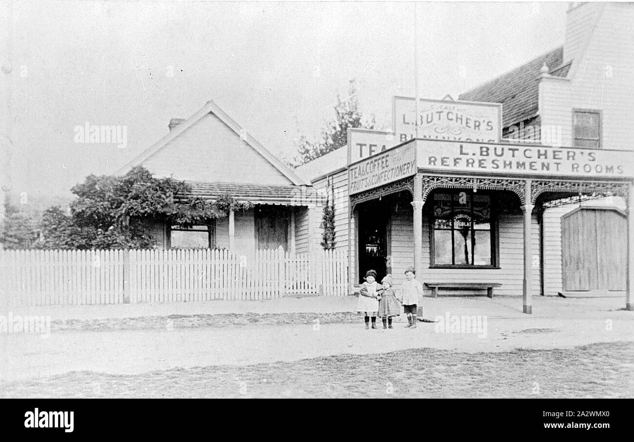 Negative - Children in Front of Levi Butcher's Refreshment Rooms, Buninyong, Victoria, circa 1905, Three small children in front of Levi Butcher's Refreshment Rooms. The Buninyong Fire Station is on the right side Stock Photo