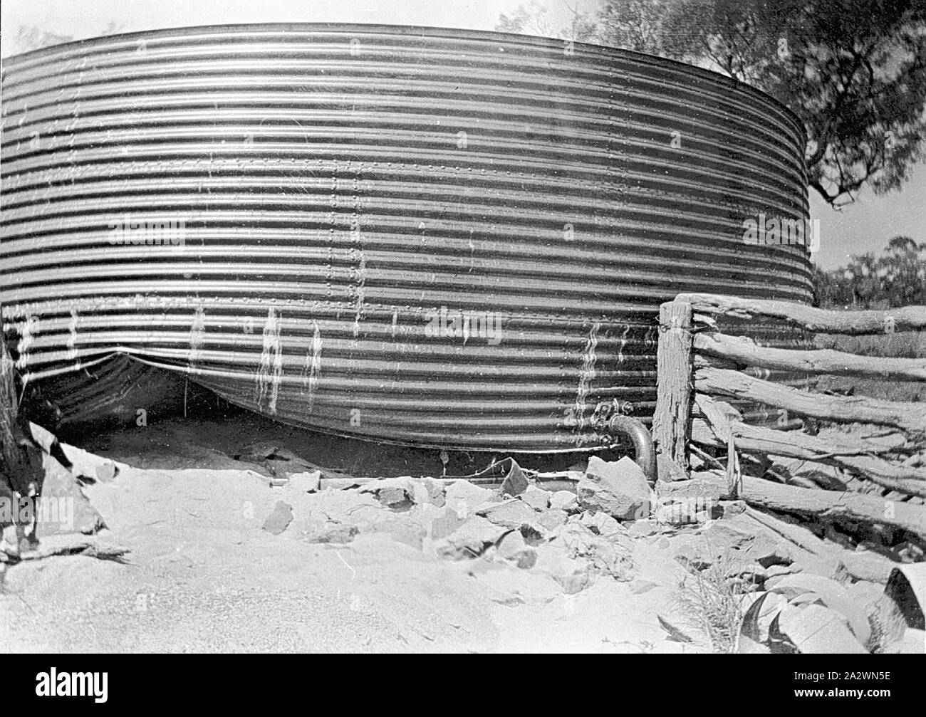 Negative - Flood Damage to a Water Tank on 'Portland Downs' Station, Isisford District, Queensland, circa 1915, Flood damage to a large water tank on 'Portland Downs' station Stock Photo